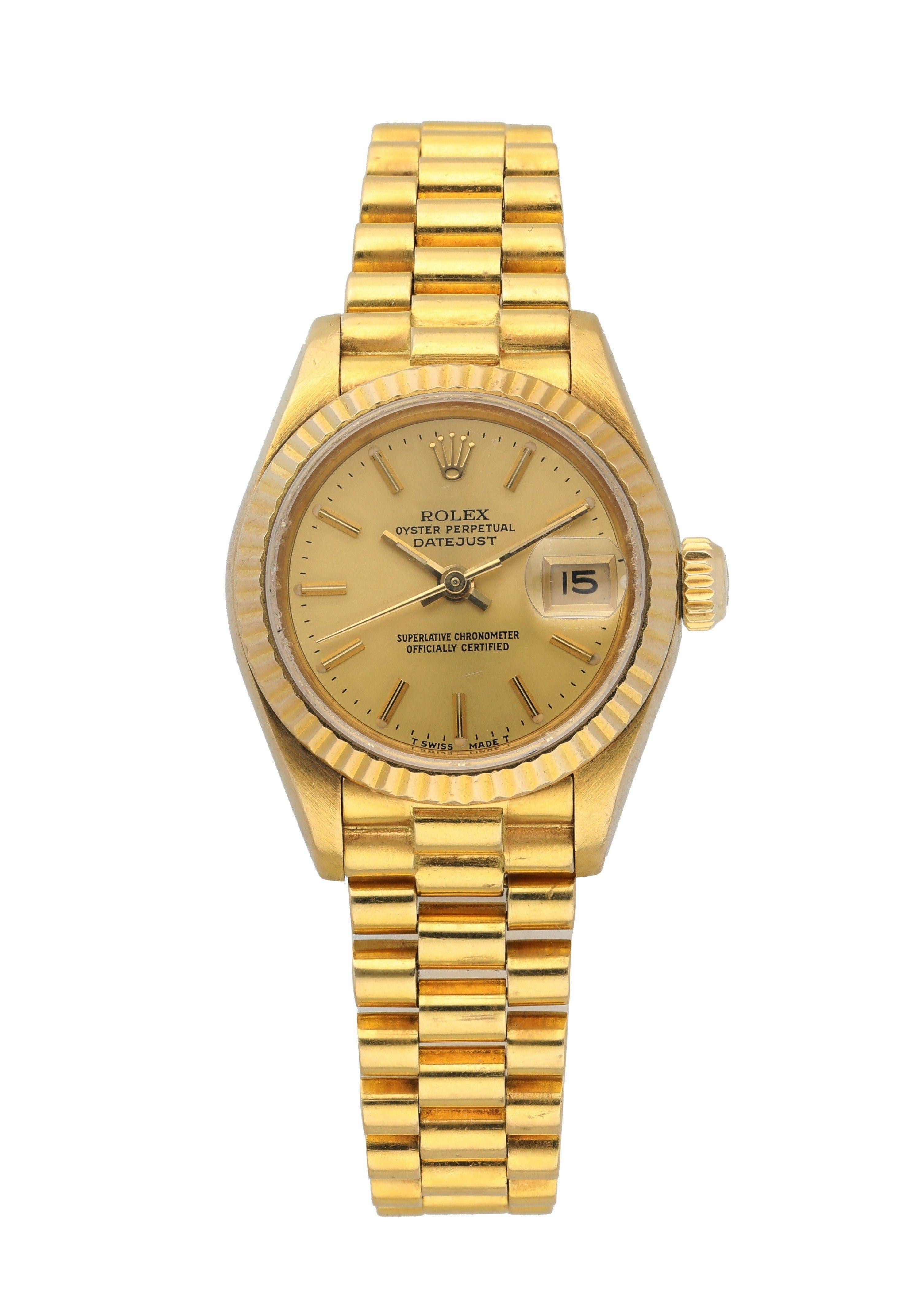 Rolex Datejust 69178 18k Yellow Gold Ladies Watch. 
26mm 18k Yellow gold case. 
Yellow Gold fluted bezel. 
Champagne dial with gold hands and index hour markers. 
Minute markers on the outer dial. 
Date display at the 3 o'clock position. 
Yellow