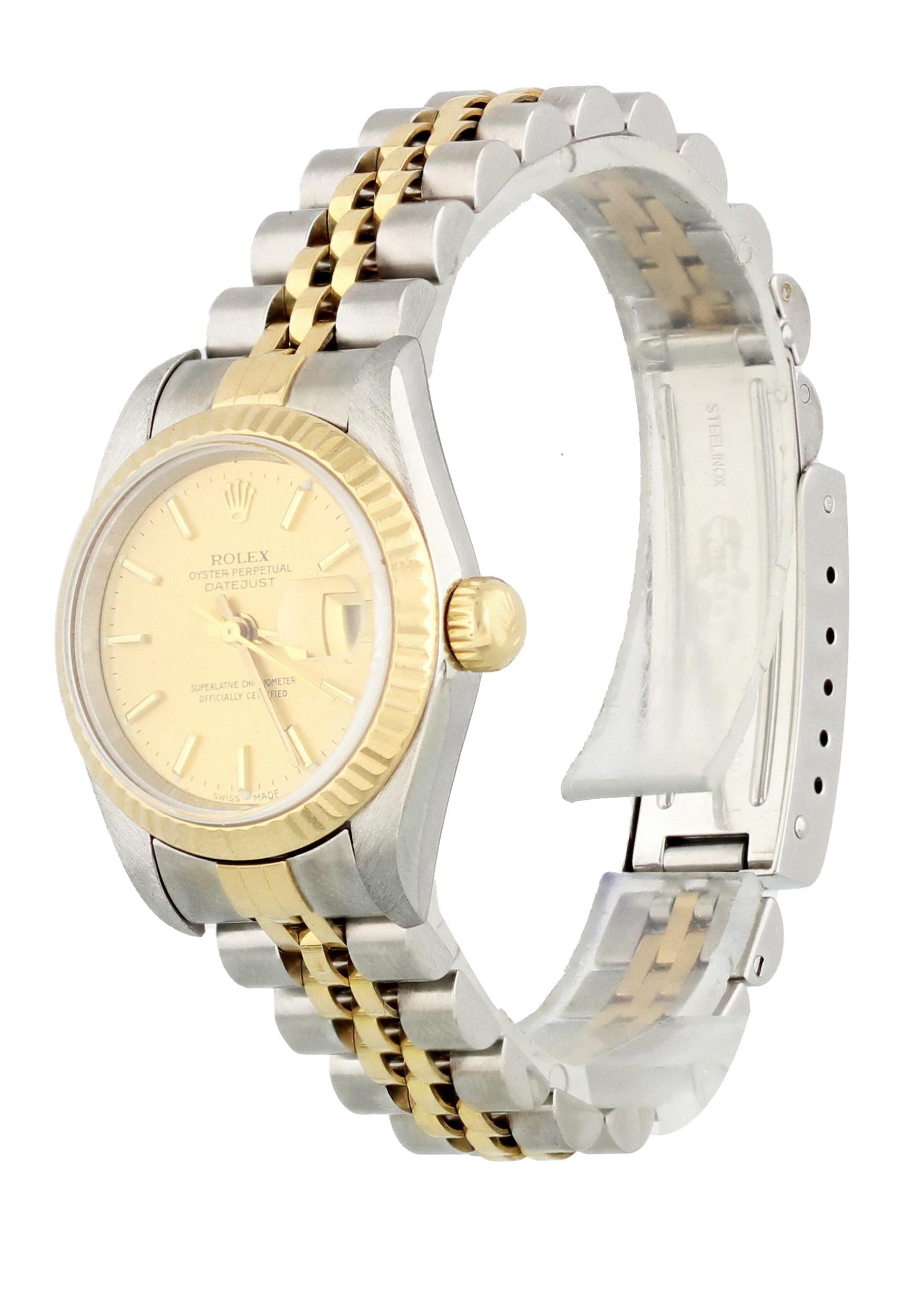 Rolex Datejust 79173 Ladies Watch. 26mm Stainless Steel case. Steel Two Tone Stationary bezel. Champagne dial with gold hands and index hour markers. Minute markers on the outer dial. Date display at the 3 o'clock position. Stainless Steel Bracelet