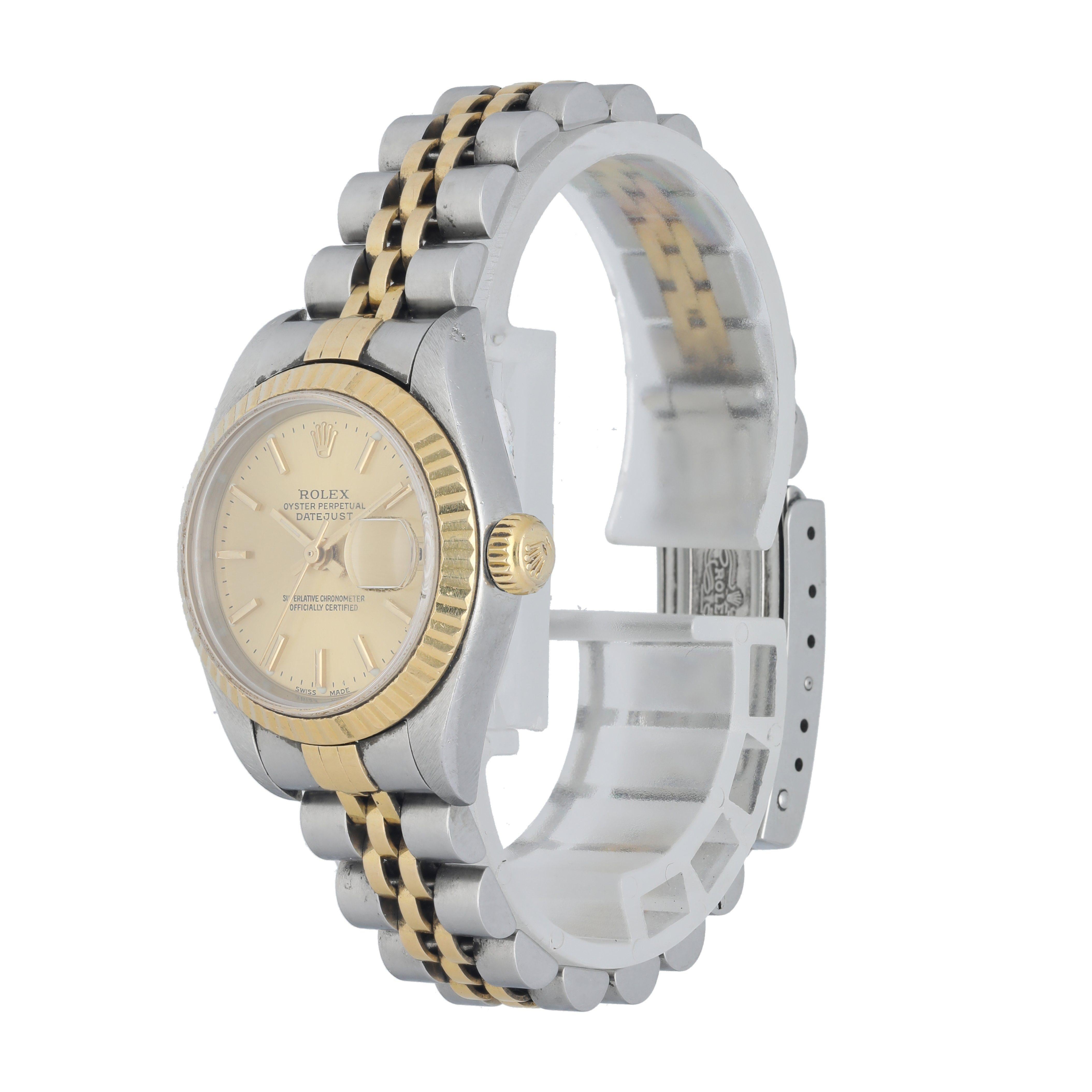 Rolex Datejust 79173 Ladies Watch. 
 26mm Stainless Steel case. 
 Yellow Gold fluted bezel. 
 Champagne dial with luminous gold hands and index hour markers. 
 Minute markers on the outer dial. 
 Date display at the 3 o'clock position. 
 Stainless