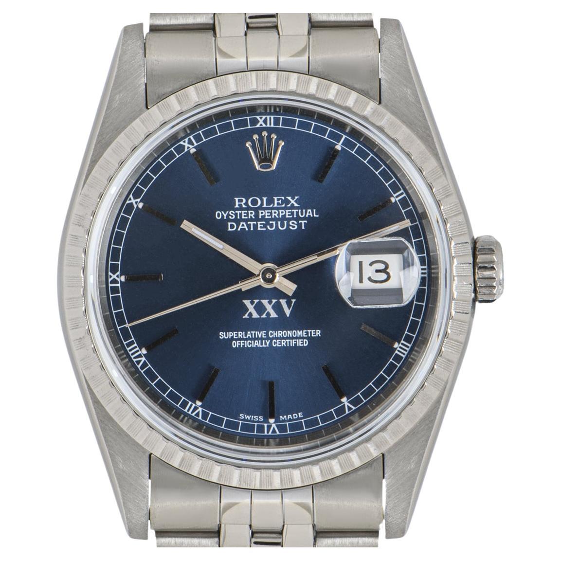 A 36mm Datejust in stainless steel by Rolex. Features a blue dial and a fixed stainless steel fluted bezel. The Jubilee bracelet comes with an Oyster deployant clasp.

Fitted with sapphire crystal and a self-winding automatic movement. This
