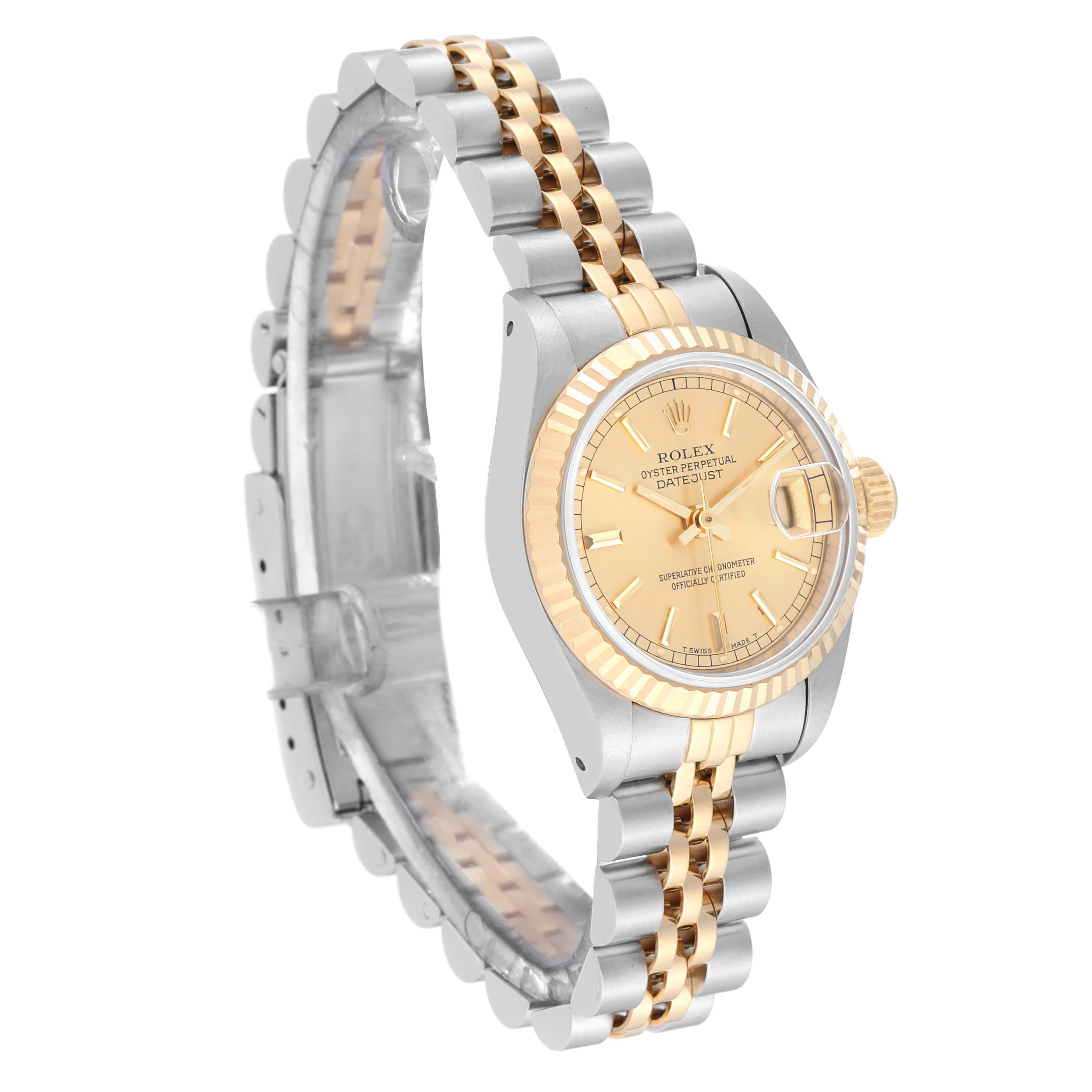 Rolex Datejust Champagne Dial Steel Yellow Gold Ladies Watch 69173. Officially certified chronometer automatic self-winding movement. Stainless steel oyster case 26.0 mm in diameter. Rolex logo on the crown. 18k yellow gold fluted bezel. Scratch