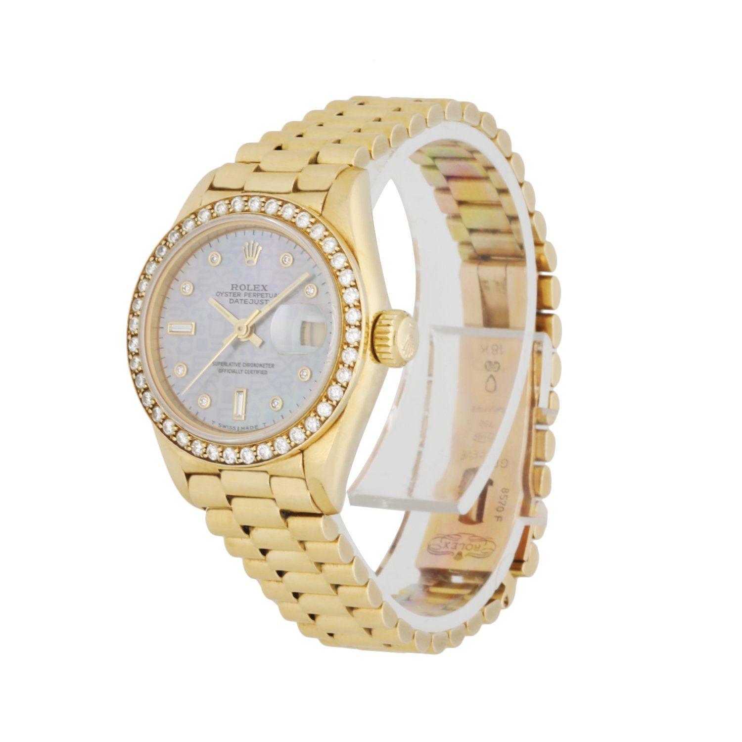 Rolex Datejust Diamond Dial 69138 Ladies Watch. 26mm 18k Yellow Gold case with factory diamond set bezel. Diamond Dial with gold hands and diamond & index hour markers. Minute markers on the outer dial. Date display at the 3 o'clock position. 18K