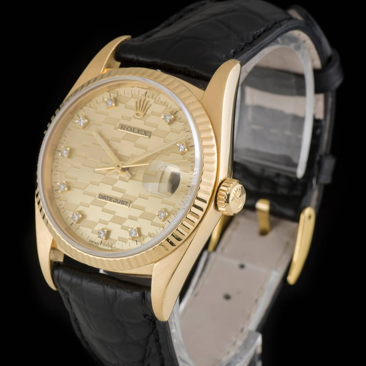 An 18k Yellow Gold Chevrolet Diamond Jubilee Award Datejust Gents Wristwatch, champane Chevrolet Logo dial with 10 applied round brilliant cut diamond hour markers, date at 3 0'clock, a fixed 18k yellow gold fluted bezel, a brand new black leather