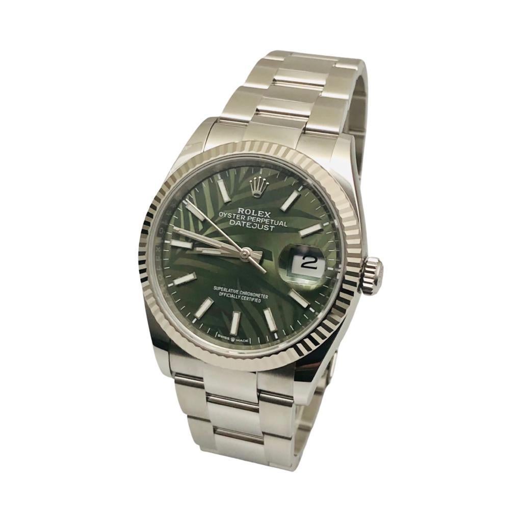 Brand: Rolex

Model Name: Datejust 36MM

Model Number: 116300

Movement: Automatic

Case Size: 36MM 

Case Back: Solid

Case Material: Stainless Steel

Bezel: Fluted (White Gold)

Dial: Green Palm Motif Dial

Bracelet: Stainless Steel; Oyster

Hour