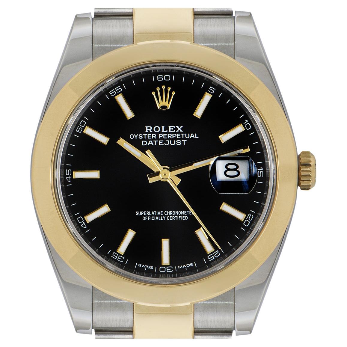A men's 41mm Datejust in stainless steel and yellow gold by Rolex. Features a black dial with yellow gold applied hour markers with a date aperture at 3 o'clock and a smooth yellow gold fixed bezel. 

Fitted with a scratch resistant sapphire crystal
