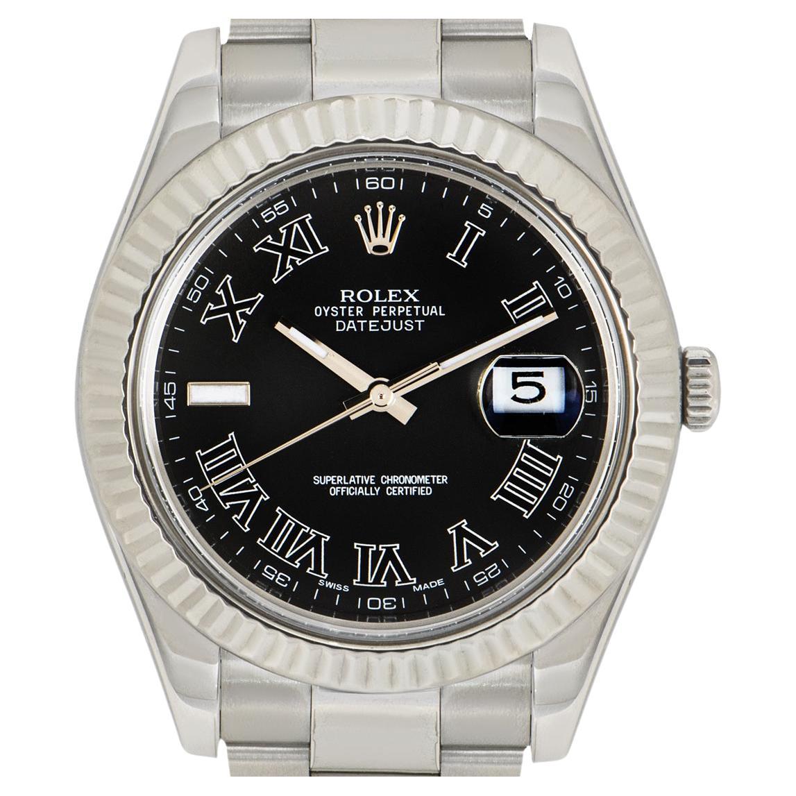 A Datejust II in stainless steel by Rolex. Featuring a black dial with roman numerals and a fixed fluted stainless steel bezel. Fitted with a sapphire crystal, self-winding automatic movement and an Oyster steel bracelet with a folding clasp. 

The