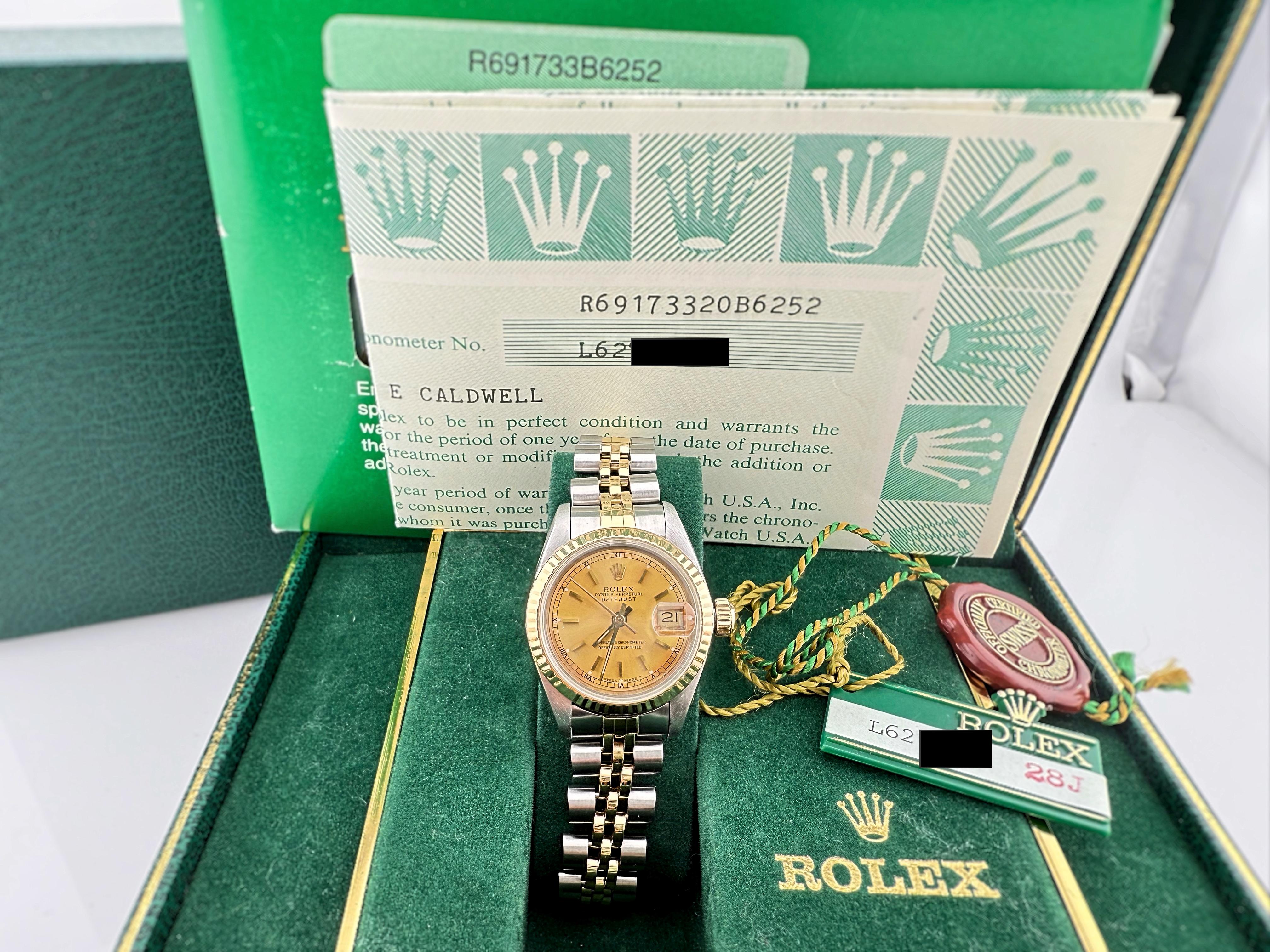 Style Number: 69173

Serial: L6****

Year: 1990

 Model: Rolex Lady Datejust Jubilee

 Case Material: Stainless Steel

 Band: Stainless Steel & 18K Yellow Gold

 Bezel: 18k Yellow Gold Fluted Bezel

 Dial: Champagne Dial

 Crystal: Sapphire