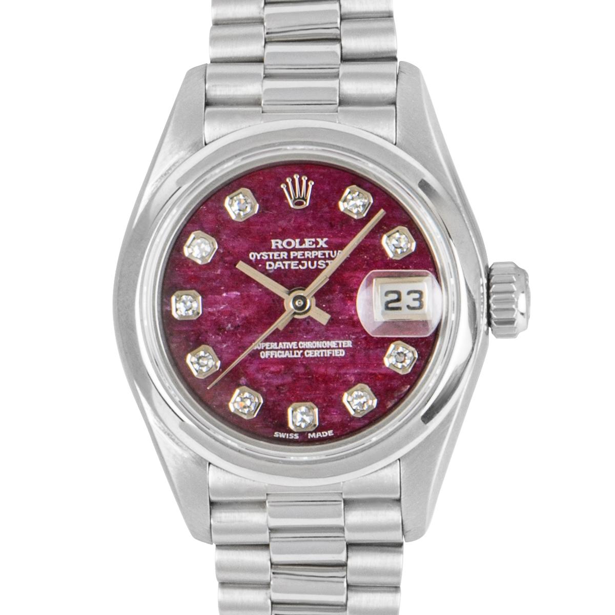 A Platinum Oyster Perpetual Datejust Ladies Wristwatch, rare rubellite stone dial set with 10 applied round brilliant cut diamond hour markers, date at 3 0'clock, a fixed platinum smooth bezel, a platinum president bracelet with a concealed platinum