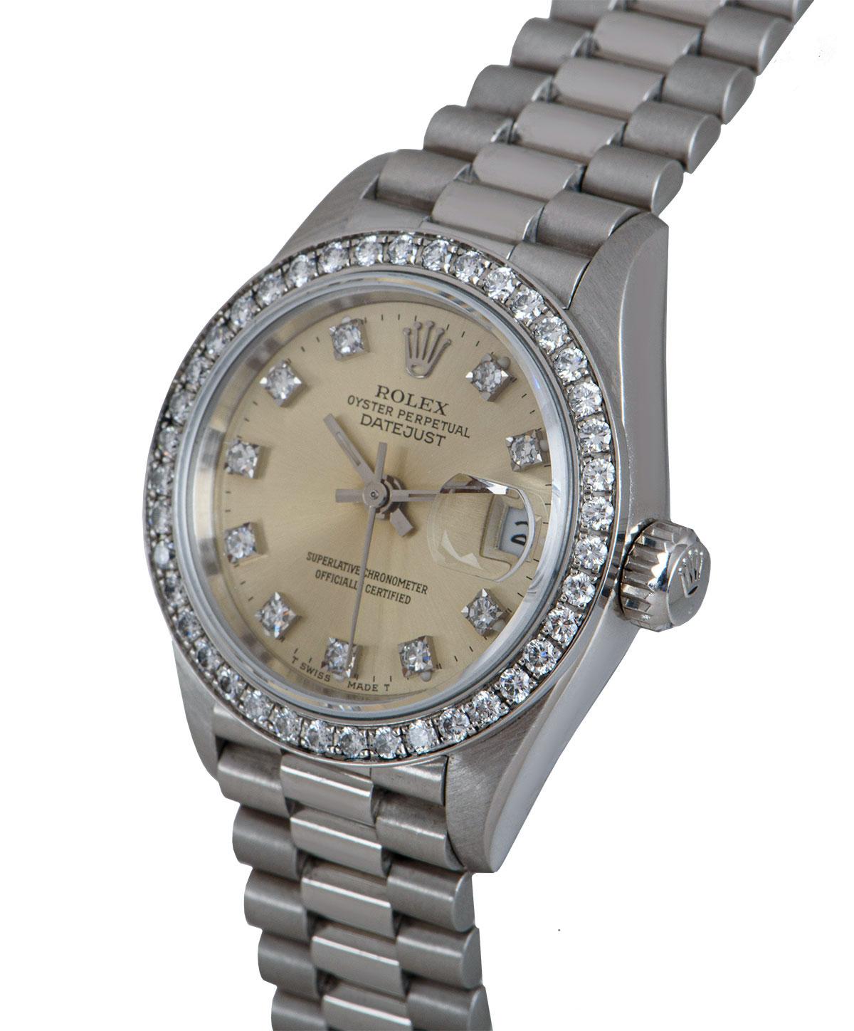 A 26 mm Platinum Oyster Perpetual Datejust Ladies Wristwatch, silver dial set with 10 applied round brilliant cut diamond hour markers, date at 3 0'clock, a fixed platinum bezel set with 40 round brilliant cut diamonds, a platinum president bracelet