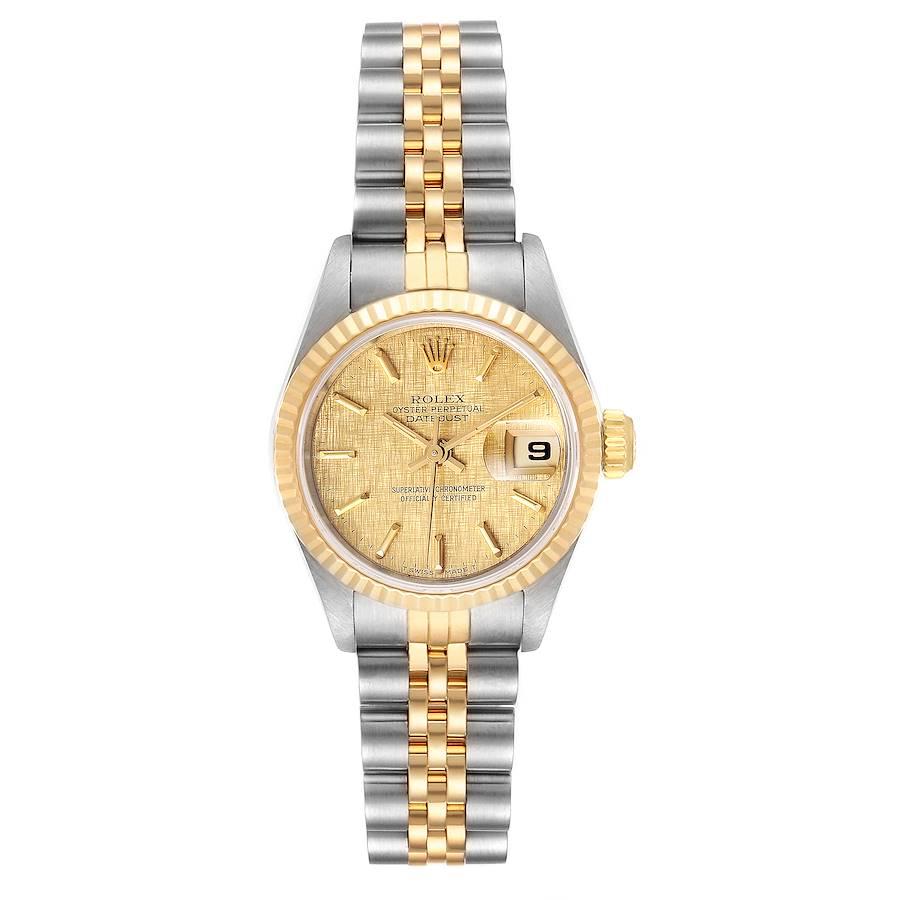 Rolex Datejust Linen Dial Steel Yellow Gold Ladies Watch 69173. Officially certified chronometer self-winding movement. Stainless steel oyster case 26.0 mm in diameter. Rolex logo on a crown. 18k yellow gold fluted bezel. Scratch resistant sapphire