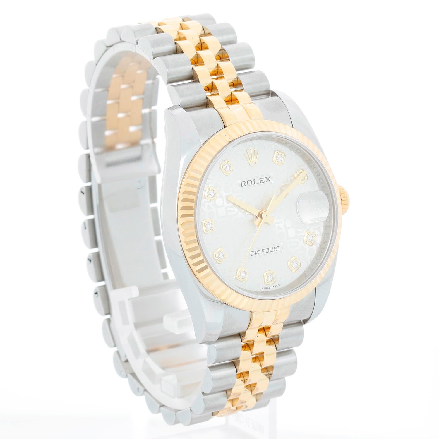 Rolex Datejust Men's 2-Tone Watch 116233 - Automatic winding, 31 jewels, Quickset, sapphire crystal. Stainless steel case with 18k yellow gold fluted bezel .  Silver Jubilee  dial with diamond  hour markers. Stainless steel and 18k yellow gold