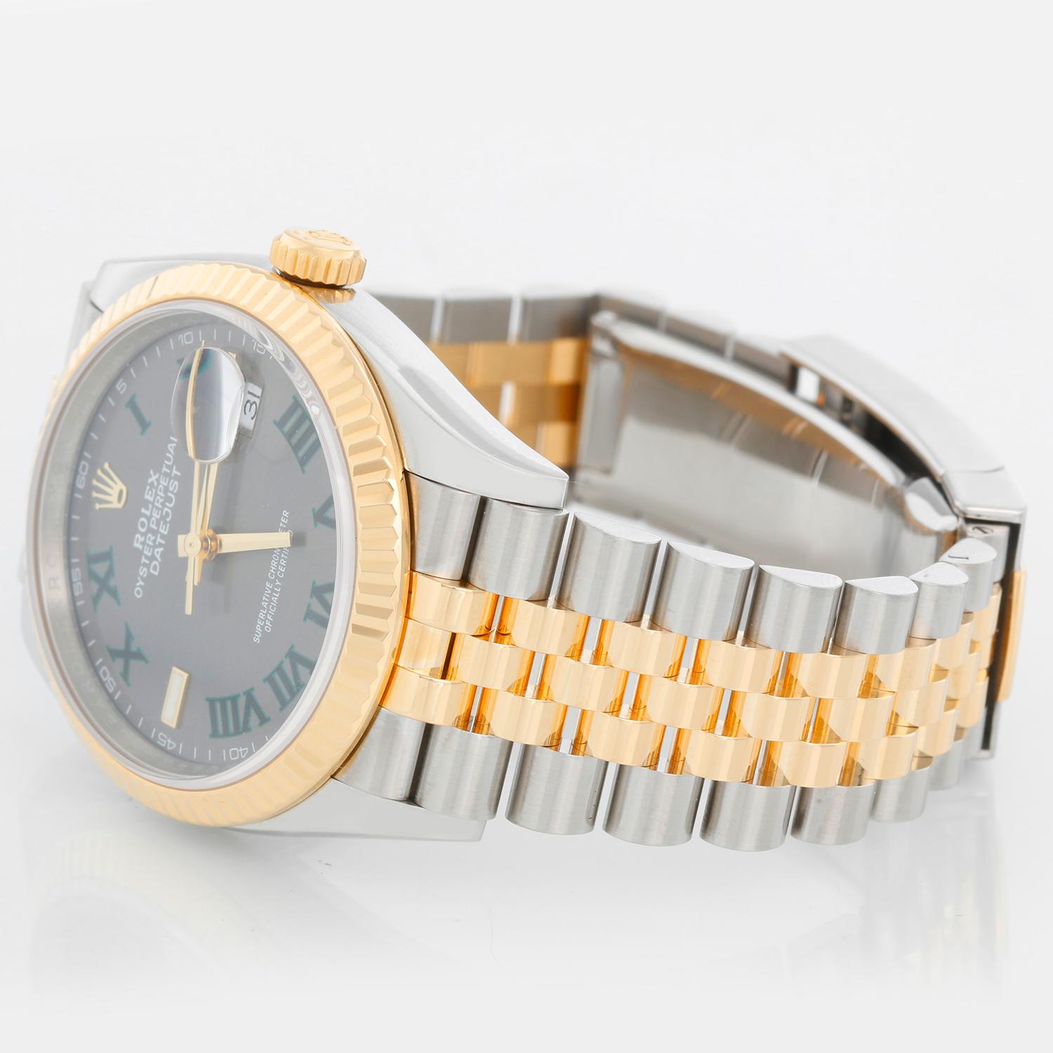 Rolex Datejust Men's 2-Tone Watch 126233 - Automatic winding, 31 jewels, Quickset, sapphire crystal. Stainless steel case with 18k yellow gold fluted bezel . Wimbledon dial . Stainless steel and 18k yellow gold Jubilee bracelet. Pre-owned with box