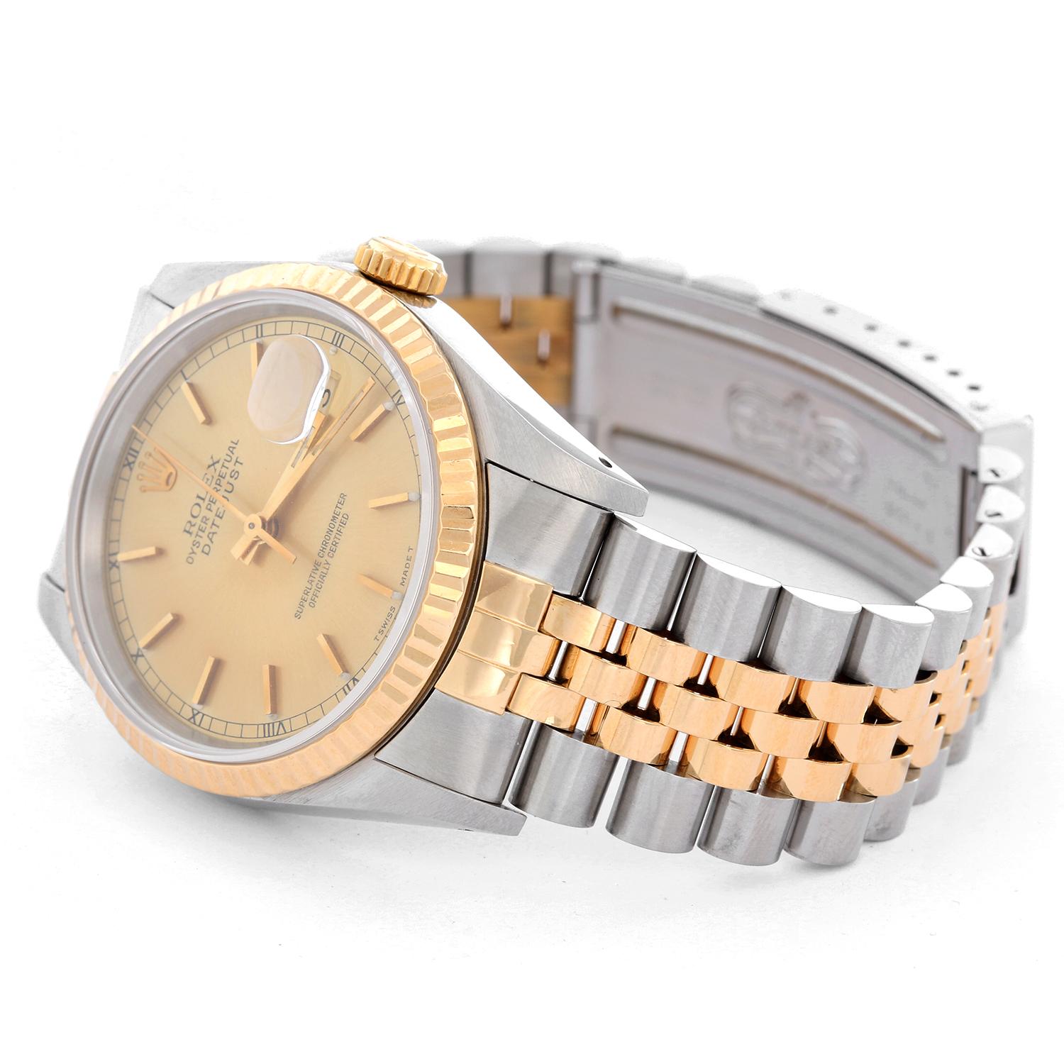 Rolex Datejust Men's 2-Tone Watch 16233 - Automatic winding, 31 jewels, Quickset, sapphire crystal. Stainless steel case with18k yellow gold fluted bezel . Champagne stick dial. Stainless steel and 18k yellow gold Jubilee bracelet. Pre-owned with