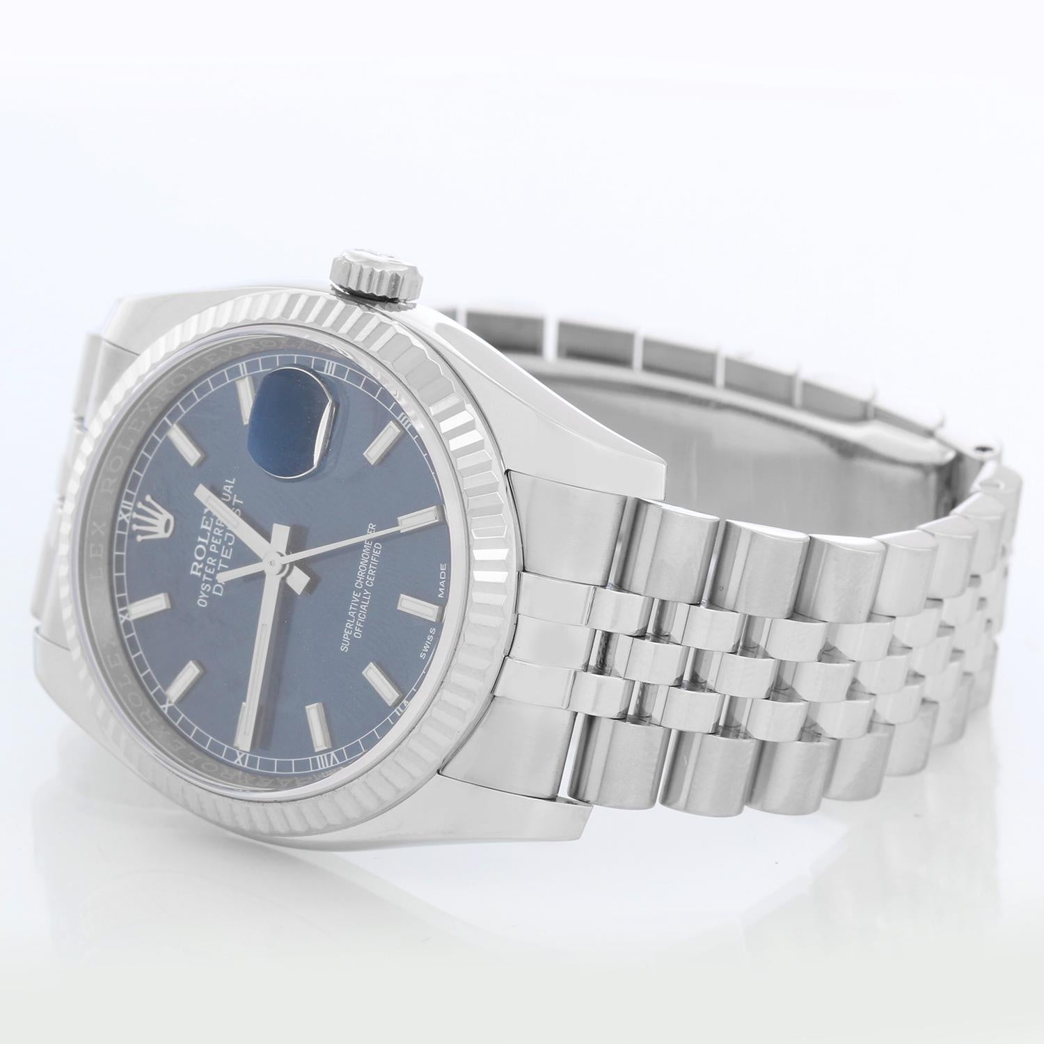 Rolex Datejust Men's Stainless Steel Watch 116234 - Automatic winding, 31 jewels, Quickset, sapphire crystal. Stainless steel case with 18k white gold fluted bezel ( 36 mm ). Blue dial with stick hour markers. Stainless steel Jubilee bracelet.