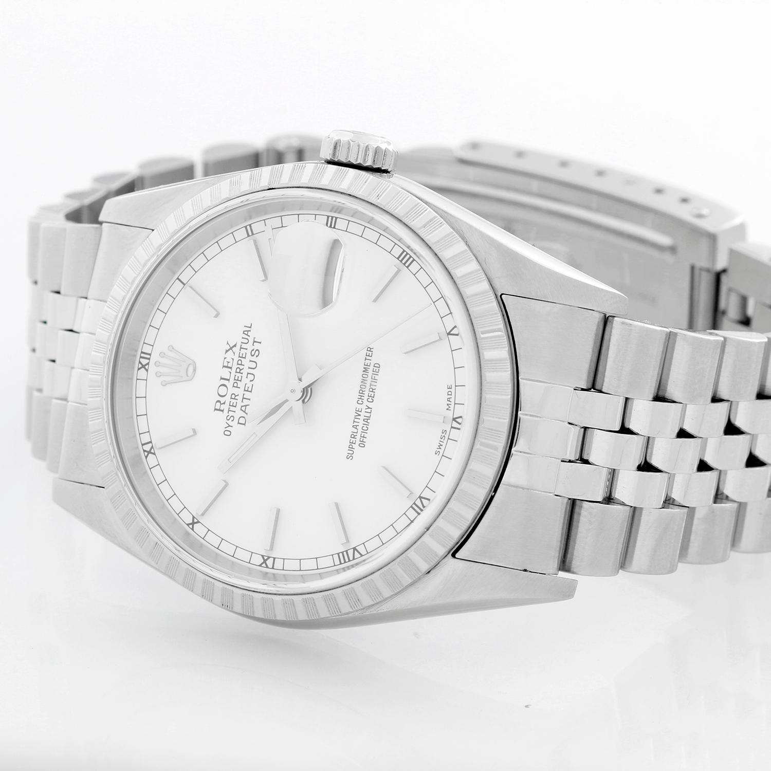 Rolex Datejust Men's Stainless Steel Watch 16220 - Automatic winding, 31 jewels, Quickset, sapphire crystal. Stainless steel case with engine turned bezel (36mm diameter). White dial with stick hour markers. Stainless steel Jubilee bracelet.