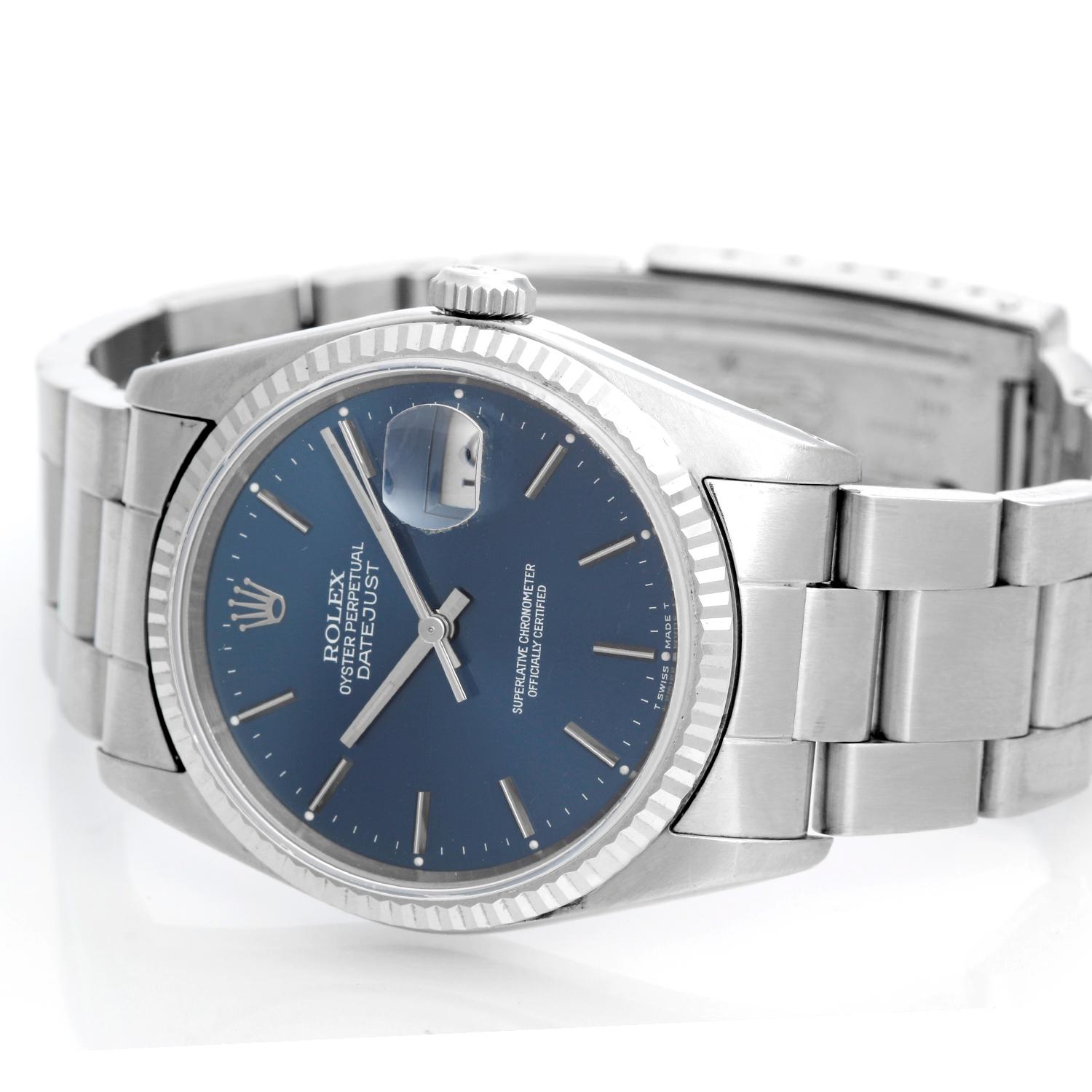 Rolex Datejust Men's Stainless Steel Watch 16234 - Automatic winding, 31 jewels, Quickset, sapphire crystal. Stainless steel case with white gold bezel  (36 mm ) . Blue dial with stick hour markers. Stainless steel Oyster bracelet. Pre-owned with