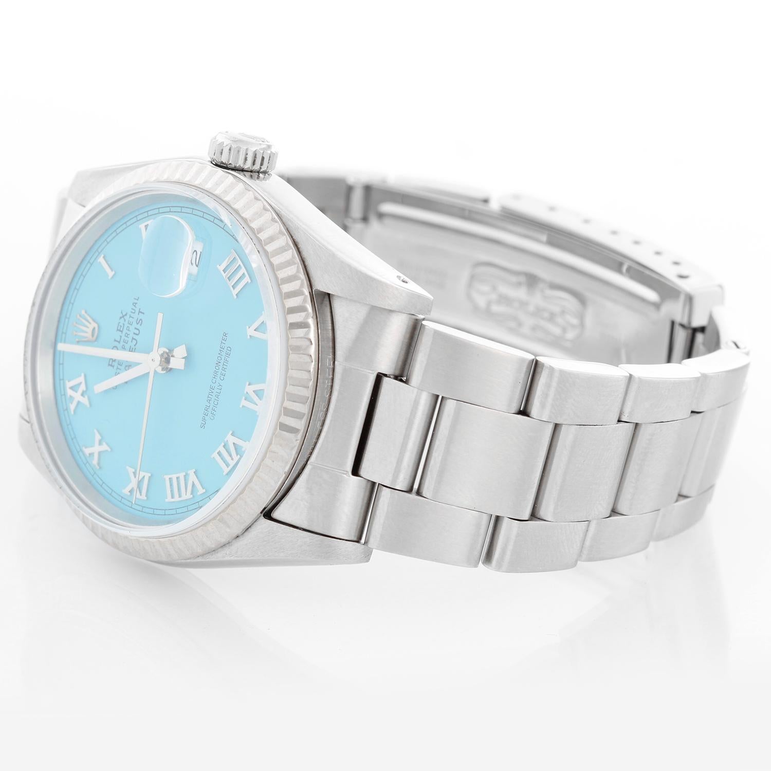 Rolex Datejust Men's Stainless Steel Watch 16234 - Automatic winding. Stainless steel case with 18k white gold fluted bezel . Custom Tiffany Blue dial Roman numeral. Stainless steel oyster bracelet. Pre-owned with custom box.