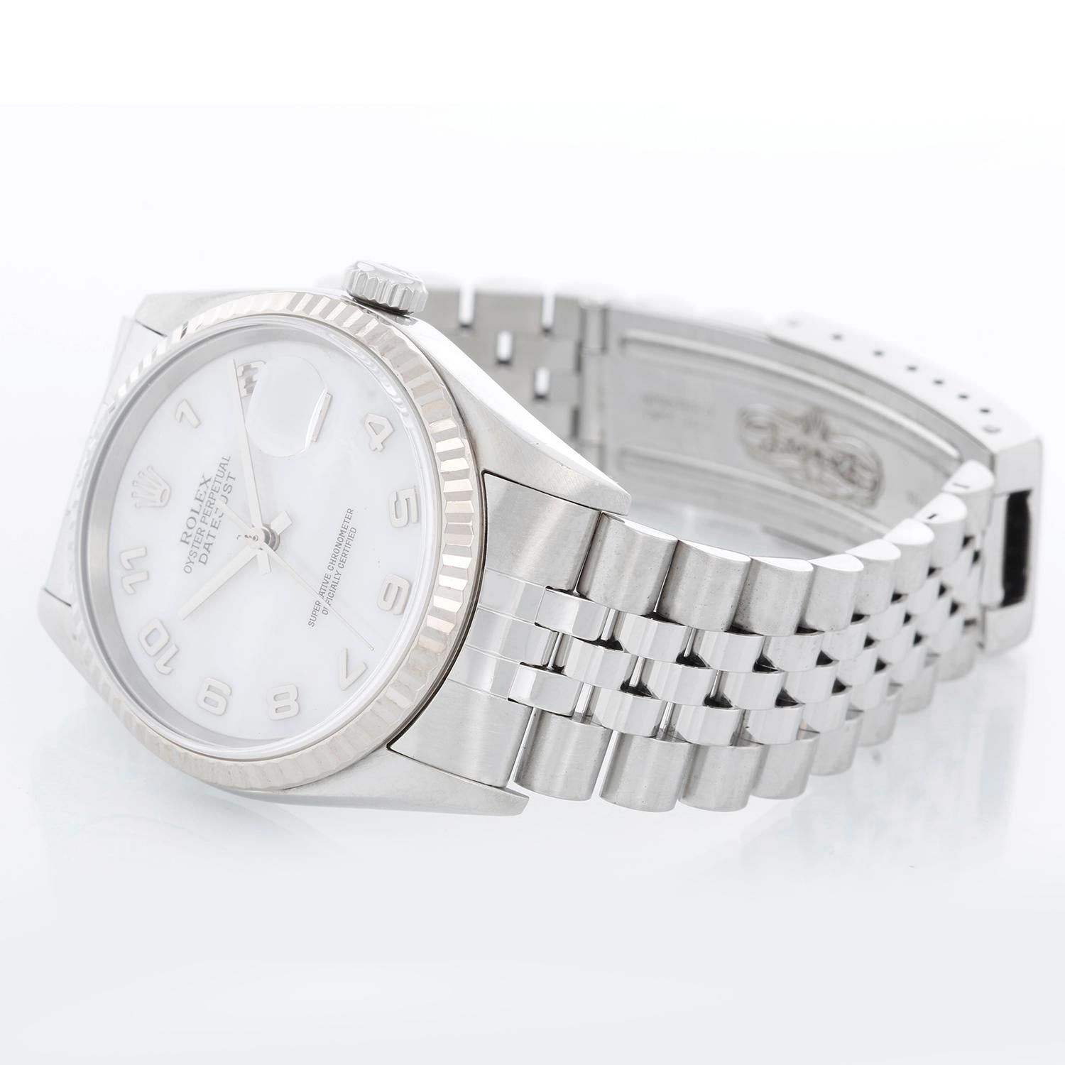 Rolex Datejust Men's Stainless Steel Watch 16234 - Automatic winding. Stainless steel case with 18k white gold fluted bezel . Factory Mother of Pearl dial . Stainless steel jubilee bracelet . Pre-owned with custom box.