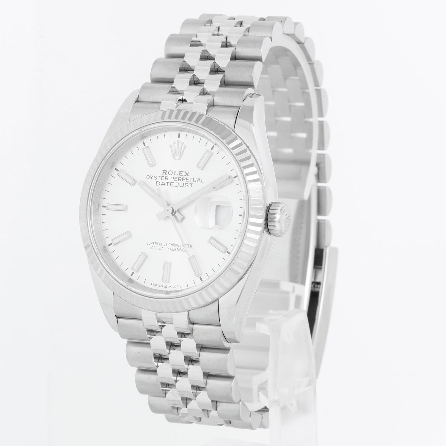 Rolex Datejust Men's Stainless Steel Watch Silver Index Dial 126234 - Automatic winding, 31 jewels, Quickset, sapphire crystal. Stainless steel case with 18k white gold fluted bezel  (36 mm). Silver dial with index markers. Stainless steel Jubilee