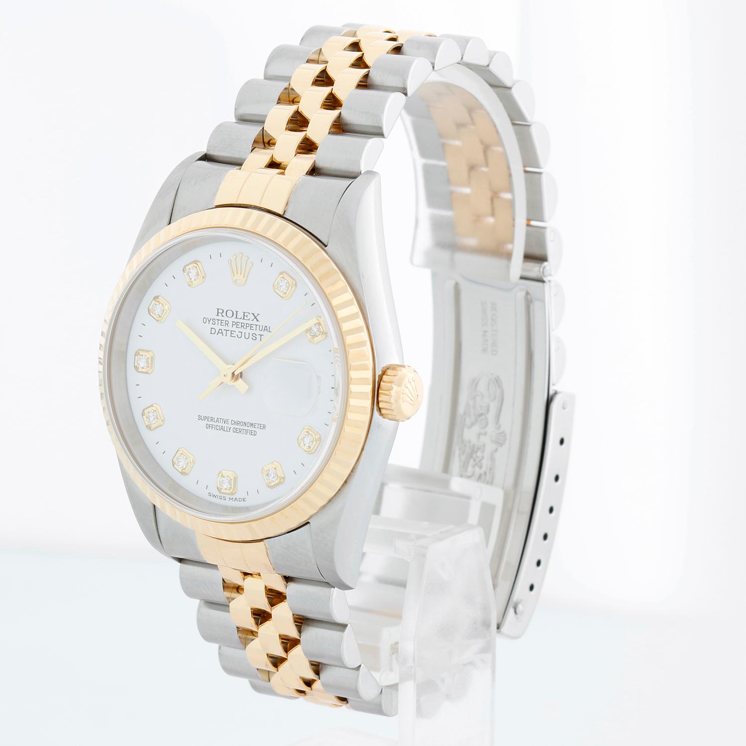 Rolex Datejust Men's White Diamond Dial 2-Tone Watch 16233 - Automatic winding, 31 jewels, Quickset, sapphire crystal. Datejust. Stainless steel with 18k yellow gold fluted bezel. White dial with diamond hours markers. Stainless steel and 18K Yellow