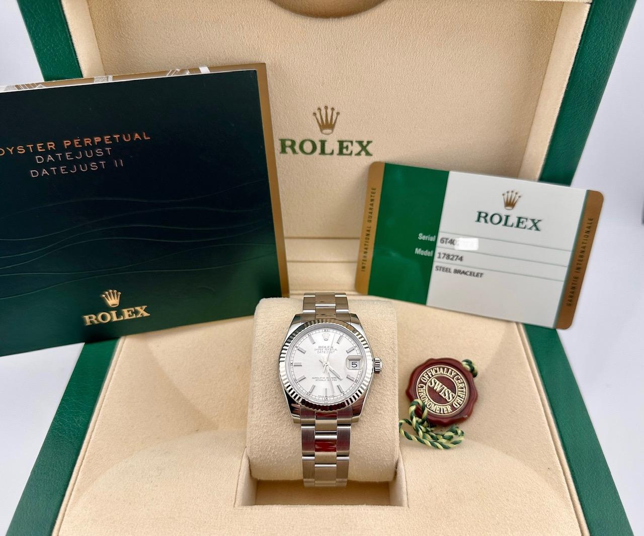 Style Number: 178274

Serial: 6T402***

Year: 2015

Model: Rolex Datejust Midsize

Case Material: Stainless Steel

Band: Stainless Steel

Bezel: 18K White Gold

 Dial: Silver

 Face: Sapphire Crystal

 Case Size: 31mm

Includes: 

-Rolex Box &