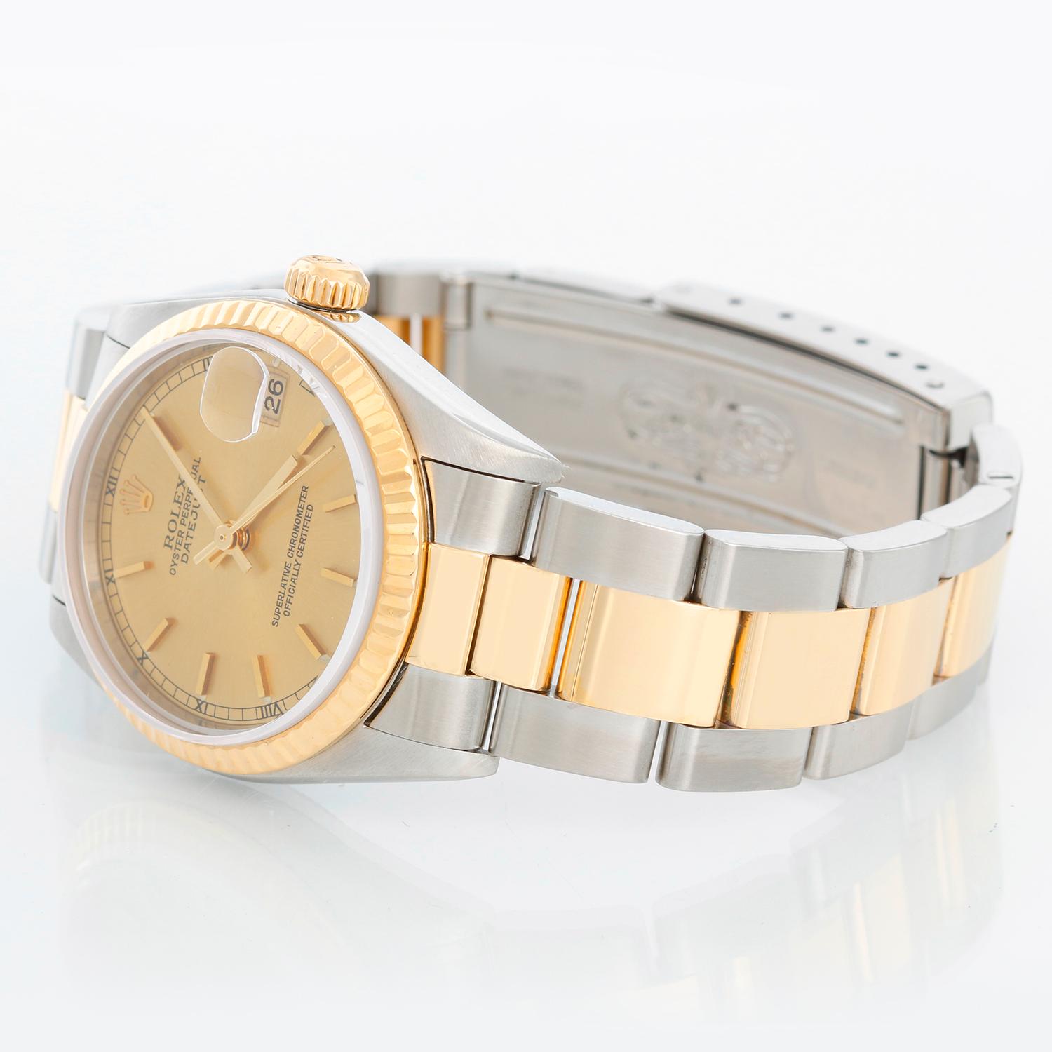 Rolex Datejust Midsize 2-Tone Men's or Ladies Watch 78273 - Automatic winding, 31 jewels, Quickset, sapphire crystal. Stainless steel case with yellow gold fluted bezel ( 31 mm ) . Champagne dial with stick hour markers. Stainless steel and 18k