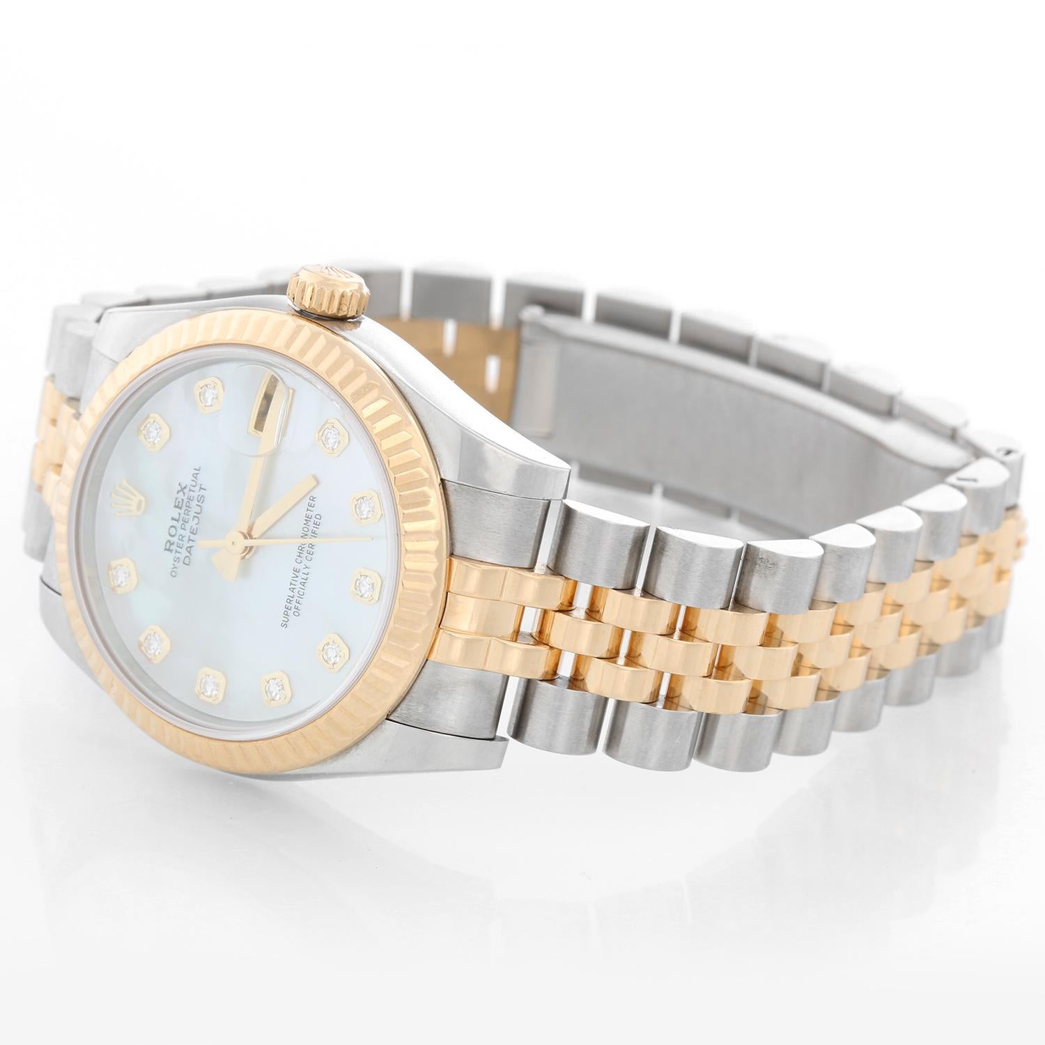 Rolex Datejust Midsize 2-Tone Watch 178273 - Automatic winding; 31 jewel; sapphire crystal. Stainless steel case with 18k yellow gold fluted bezel  (31mm diameter). Factory Mother of Pearl dial with diamond hour markers. Stainless steel and gold