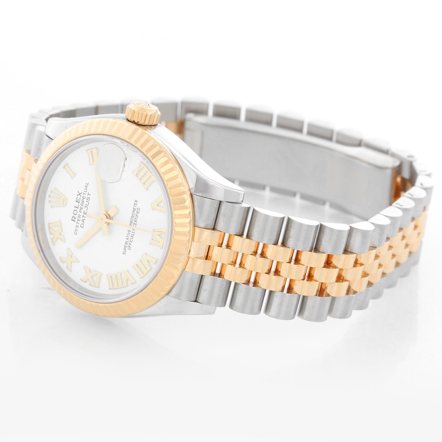 Rolex Datejust Midsize 2-Tone Watch 278273 - Automatic winding; 31 jewel; sapphire crystal. Stainless steel case with 18k yellow gold fluted bezel (31mm diameter). White dial with raised gold Roman numerals. Stainless steel hidden-clasp Jubilee