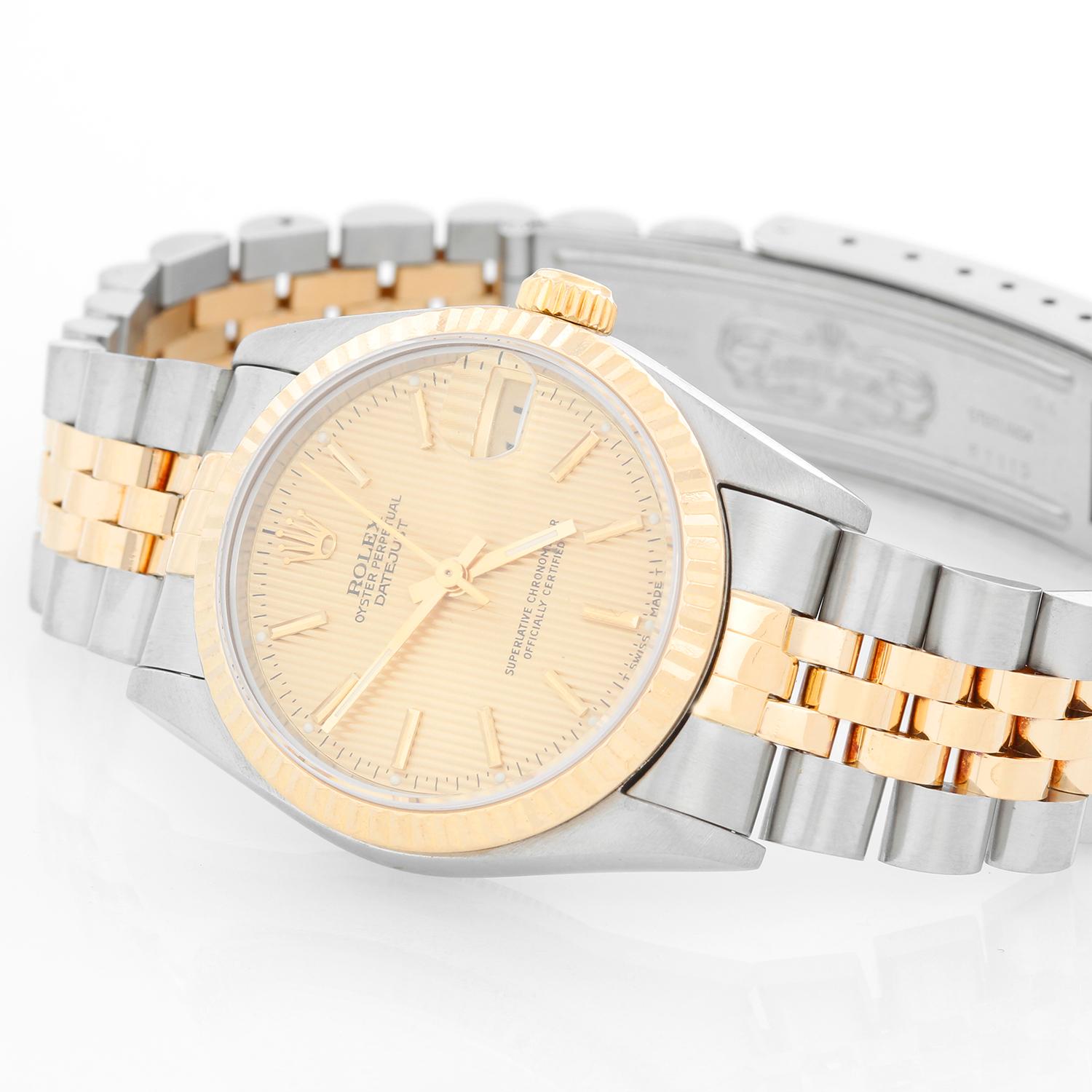 Rolex Datejust Midsize 2-Tone Watch 68273 - Automatic winding, 29 jewels, Quickset, sapphire crystal.  Stainless steel case with 18k yellow gold  fluted bezel. Textured champagne dial with stick hour markers . Stainless steel and 18k yellow gold
