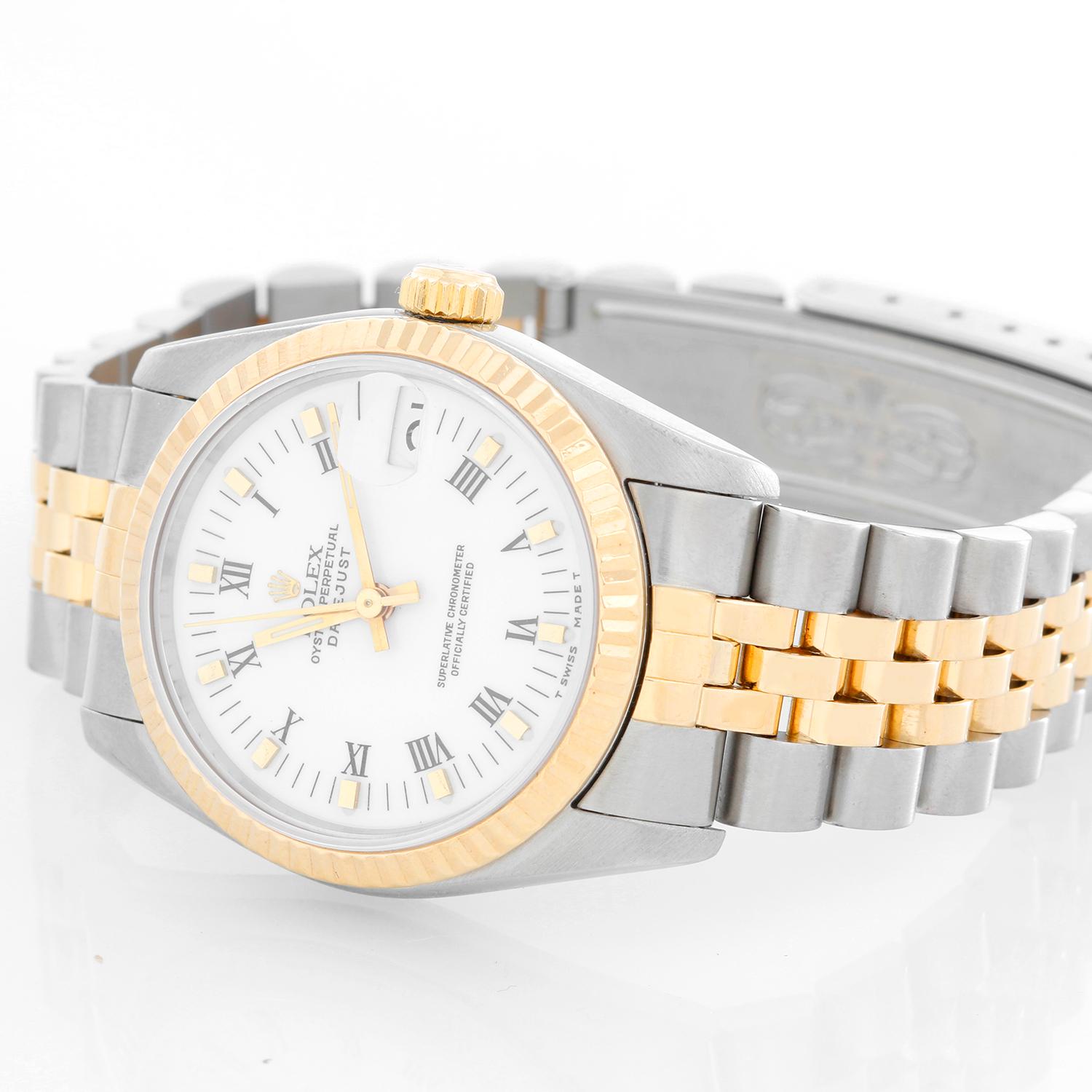 Rolex Datejust Midsize 2-Tone Watch 68273 - Automatic winding, 29 jewels, Quickset, sapphire crystal. Stainless steel case with 18k yellow gold  fluted bezel. White dial with black Roman numerals and gold hour markers. Stainless steel and 18k yellow