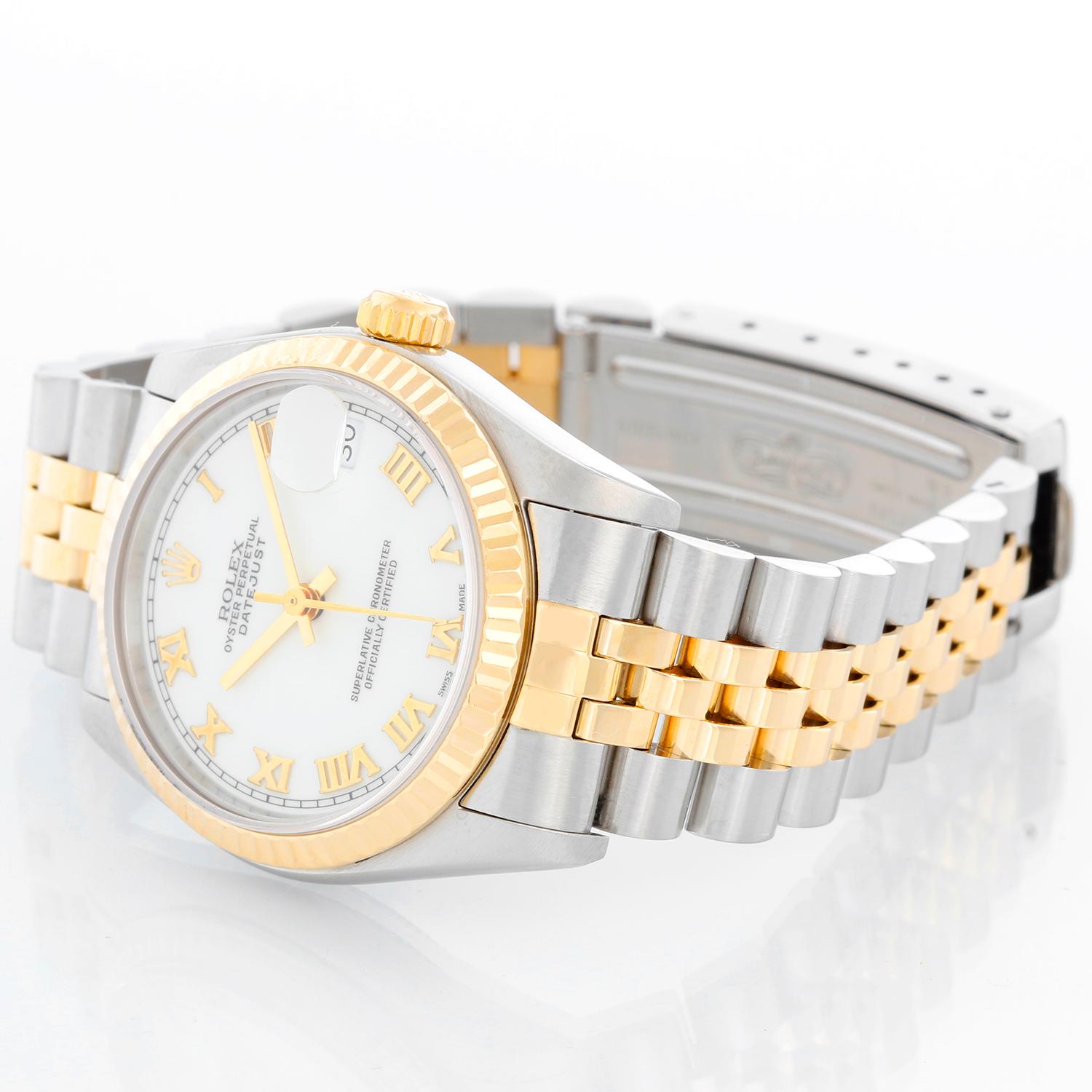 Rolex Datejust Midsize 2-Tone Watch 68273 - Automatic winding, 29 jewels, Quickset, sapphire crystal.  Stainless steel case with 18k yellow gold  fluted bezel. White dial with black Roman numerals and gold hour markers. Stainless steel and 18k