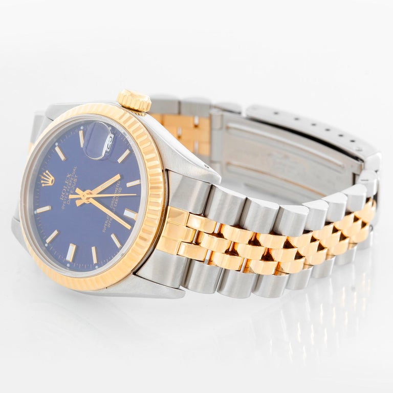 Rolex Datejust Midsize 2-Tone Watch 68273 - Automatic winding, 29 jewels, Quickset, sapphire crystal.  Stainless steel case with 18k yellow gold  fluted bezel. Blue dial with stick hour markers . Stainless steel and 18k yellow gold Jubilee bracelet.