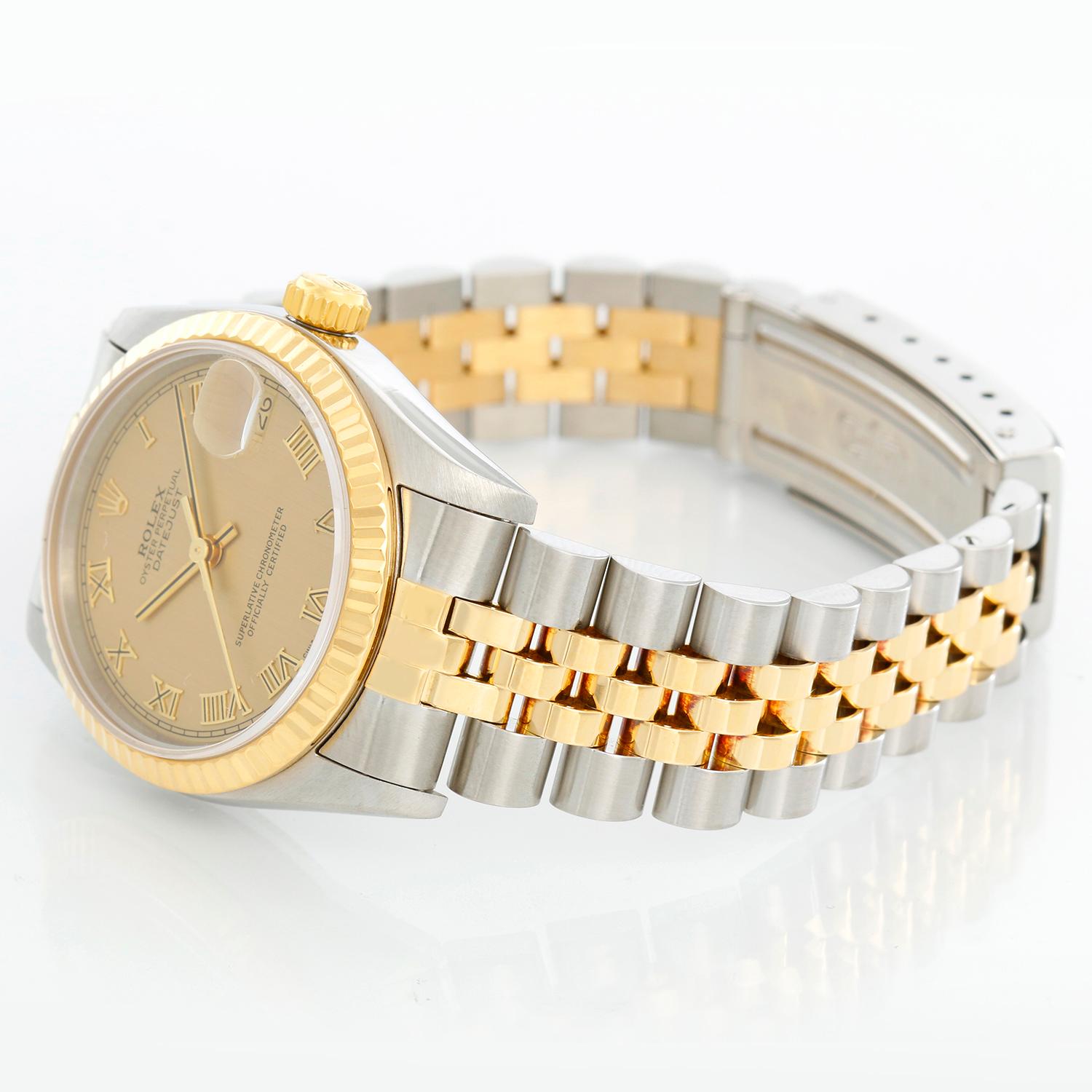 Rolex Datejust Midsize 2-Tone Watch 68273 - Automatic winding, 29 jewels, Quickset, sapphire crystal.  Stainless steel case with 18k yellow gold  fluted bezel. Champagne dial with roman numerals. Stainless steel and 18k yellow gold Oyster bracelet.