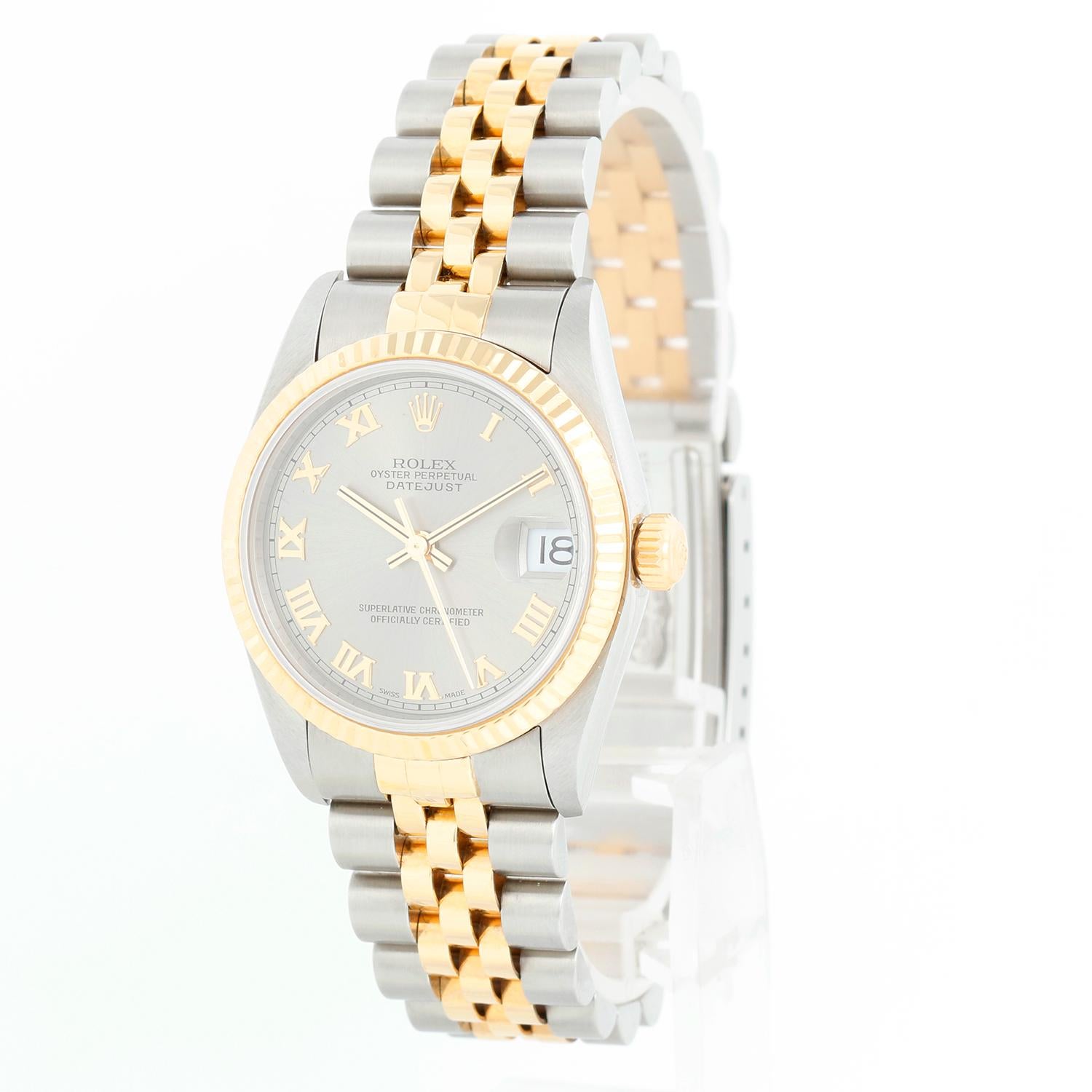 Rolex Datejust Midsize 2-Tone Watch 68273 - Automatic winding, 29 jewels, Quickset, sapphire crystal.  Stainless steel case with 18k yellow gold  fluted bezel. Rhodium dial with Roman numerals . Stainless steel and 18k yellow gold Jubilee bracelet.