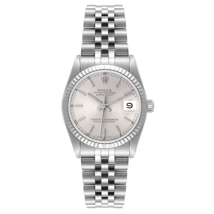 Rolex Datejust Midsize 31 Silver Dial Steel Ladies Watch 68274. Officially certified chronometer self-winding movement. Stainless steel oyster case 31.0 mm in diameter. Rolex logo on a crown. 18k white gold fluted bezel. Scratch resistant sapphire