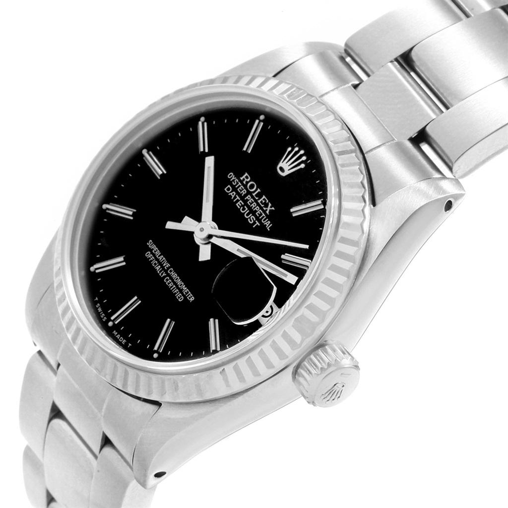 Rolex Datejust Midsize 31 Steel White Gold Black Dial Ladies Watch 68274. Officially certified chronometer self-winding movement. Stainless steel oyster case 31.0 mm in diameter. Rolex logo on a crown. 18k white gold fluted bezel. Scratch resistant