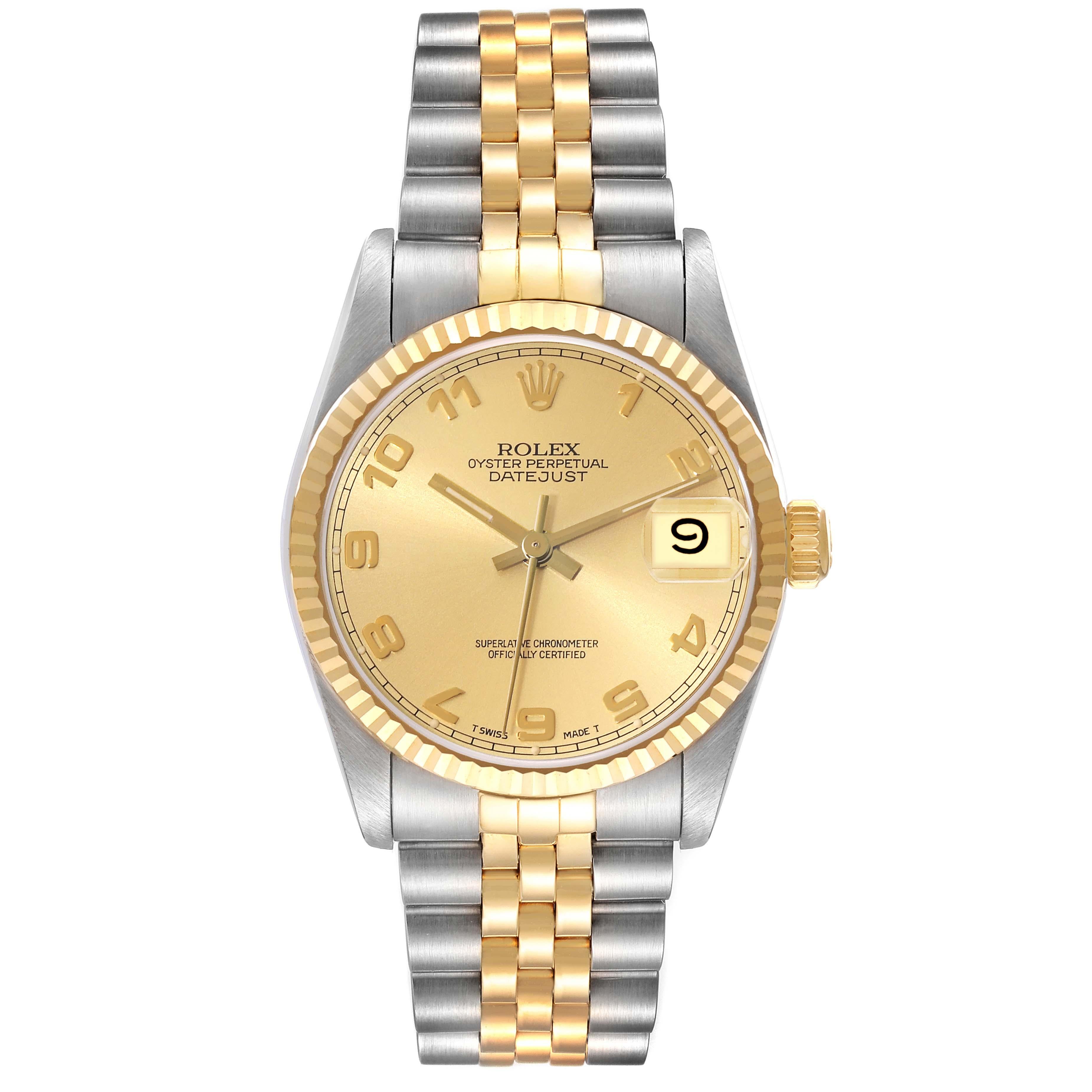 Rolex Datejust Midsize Arabic Dial Steel Yellow Gold Ladies Watch 68273. Officially certified chronometer automatic self-winding movement. Stainless steel oyster case 31 mm in diameter. Rolex logo on an 18K yellow gold crown. 18k yellow gold fluted