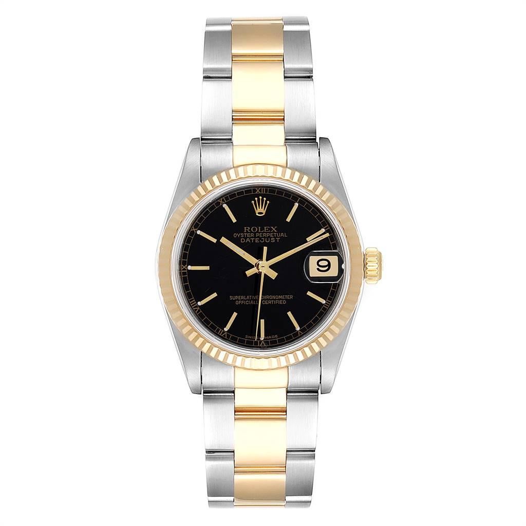 Rolex Datejust Midsize Black Dial Steel Yellow Gold Ladies Watch 78273. Officially certified chronometer self-winding movement. Stainless steel oyster case 31.0 mm in diameter. Rolex logo on 18K yellow gold crown. 18k yellow gold fluted bezel.