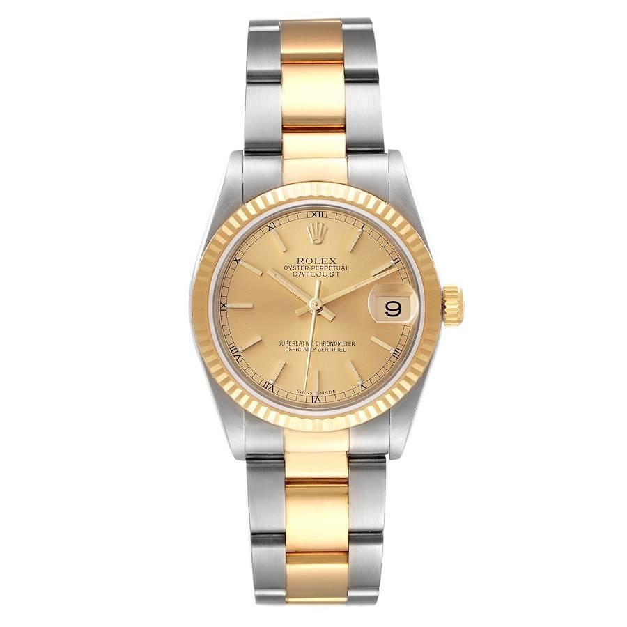 Rolex Datejust Midsize Champagne Dial Steel Yellow Gold Ladies Watch 78273. Officially certified chronometer self-winding movement. Stainless steel oyster case 31.0 mm in diameter. Rolex logo on 18K yellow gold crown. 18k yellow gold fluted bezel.