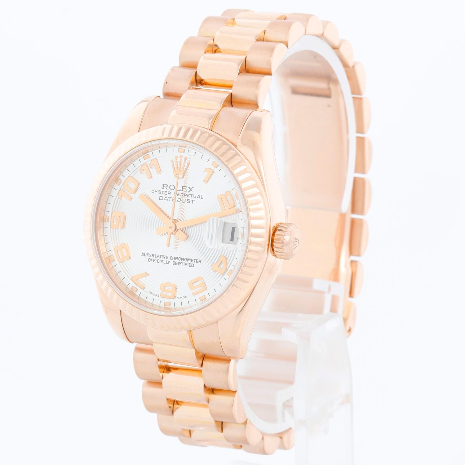 Rolex Datejust Midsize Men's or Ladies Rose Gold Watch 178275 - Automatic winding; 31 jewel; sapphire crystal. 18K Rose gold  case with 18k rose gold fluted bezel (31mm diameter). Silver concentric dial with rose gold Arabic numerals. 18K Rose gold