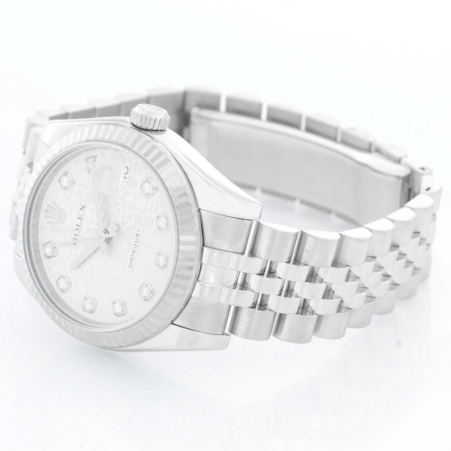 Rolex Datejust Midsize Men's or Ladies Steel Watch 178274 - Automatic winding; 31 jewel; sapphire crystal. Stainless steel case with 18k white gold fluted bezel (31mm diameter). Silver Rolex Jubilee diamond dial. Stainless steel hidden-clasp Jubilee
