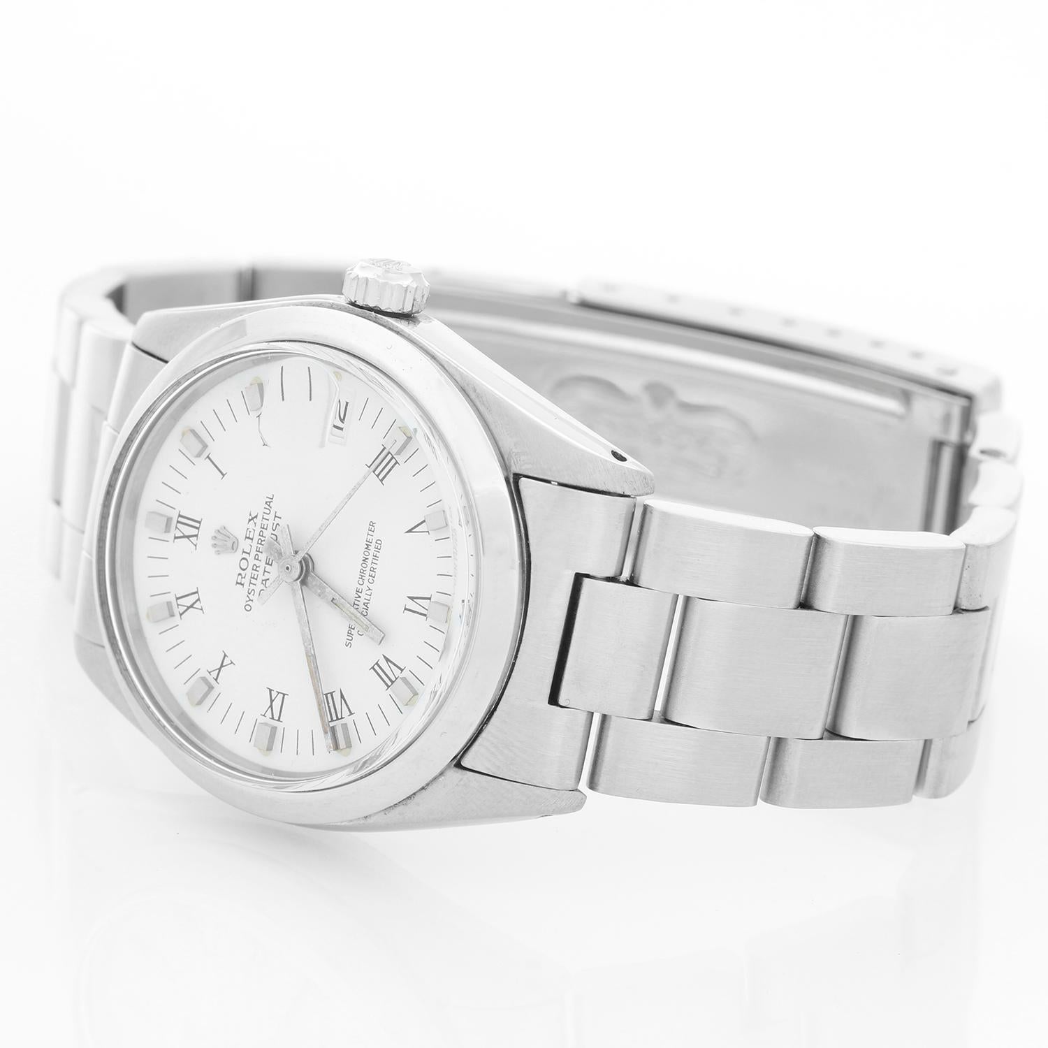 Rolex Datejust Midsize Men's or Ladies Steel Watch 6824 - Automatic winding, 29 jewels, Quickset date, sapphire crystal. Stainless steel case with smooth bezel (31mm diameter). White dial with Roman numerals. Stainless Steel Oyster Bracelet . Pre-