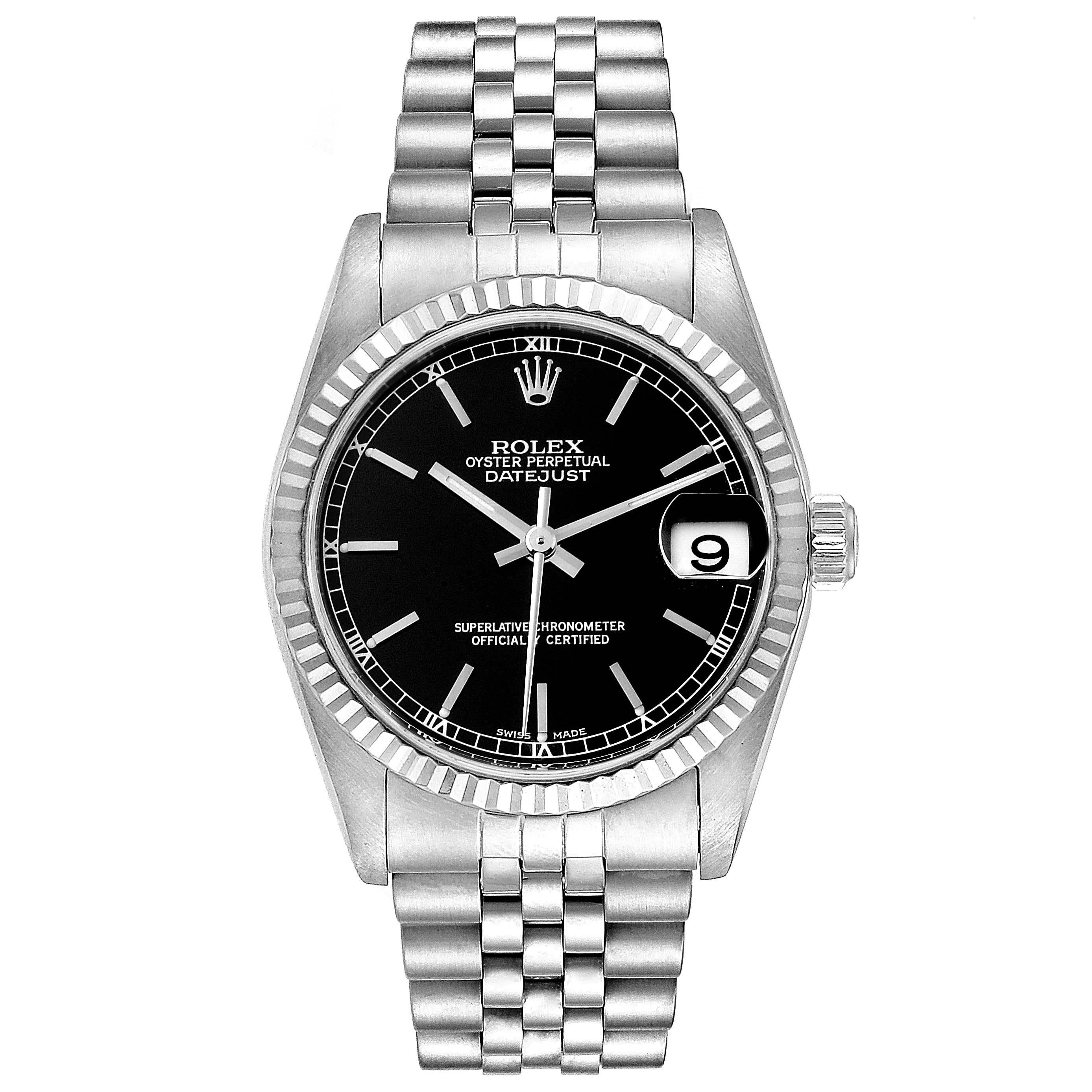 Rolex Datejust Midsize Steel White Gold Black Dial Ladies Watch 78274. Officially certified chronometer self-winding movement. Stainless steel oyster case 31 mm in diameter. Rolex logo on a crown. 18k white gold fluted bezel. Scratch resistant