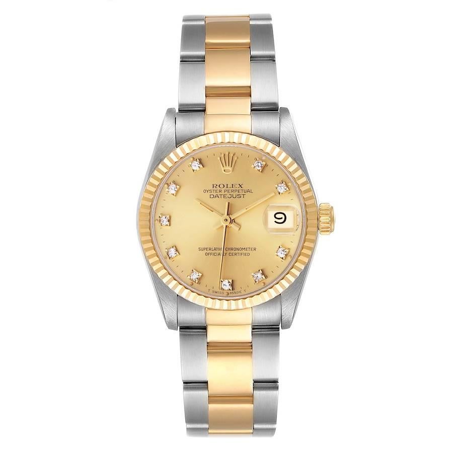 Rolex Datejust Midsize Steel Yellow Gold Diamond Ladies Watch 68273. Officially certified chronometer self-winding movement. Stainless steel oyster case 31 mm in diameter. Rolex logo on a 18K yellow gold crown. 18k yellow gold fluted bezel. Scratch