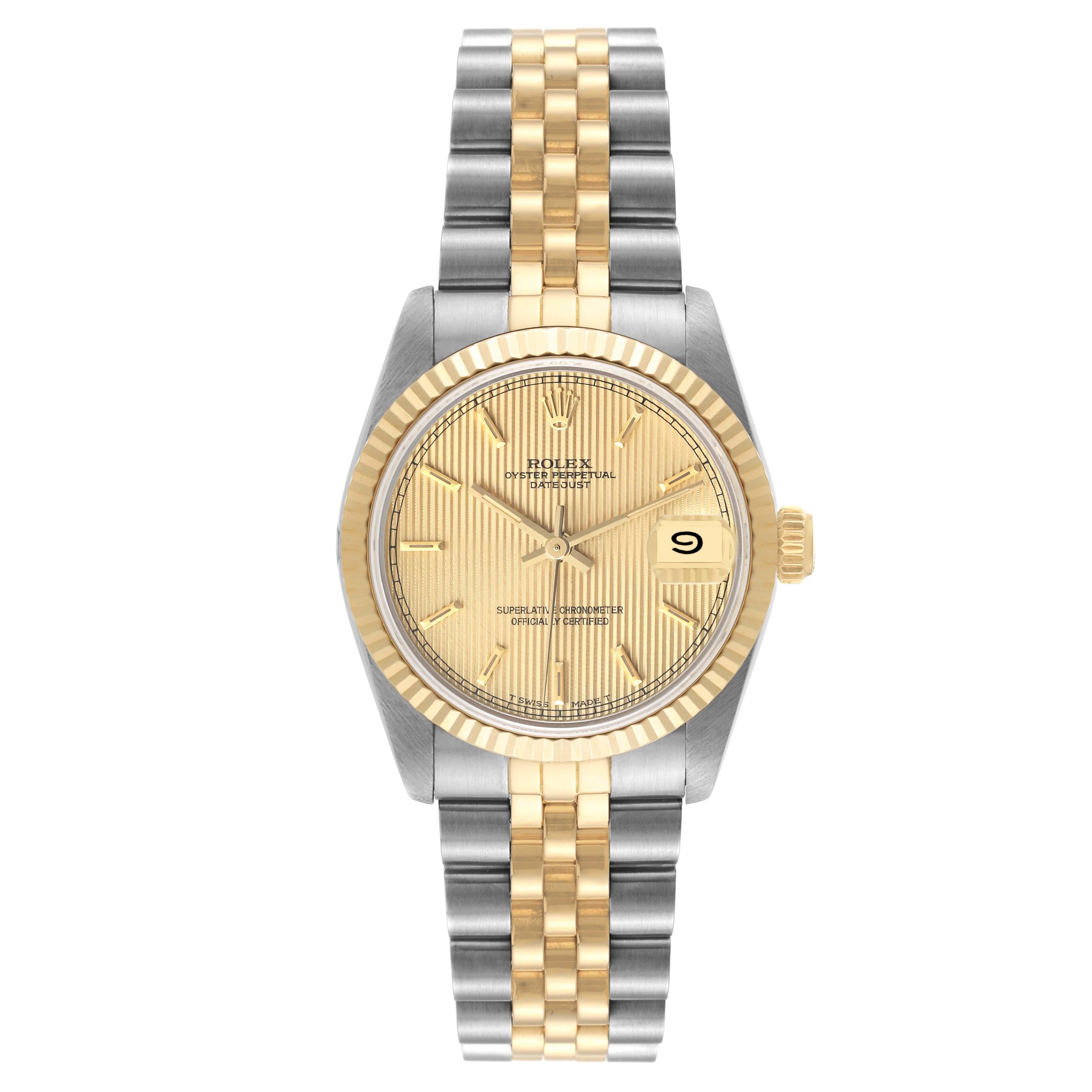 Rolex Datejust Midsize Tapestry Dial Steel Yellow Gold Ladies Watch 68273. Officially certified chronometer automatic self-winding movement. Stainless steel oyster case 31 mm in diameter. Rolex logo on an 18K yellow gold crown. 18k yellow gold