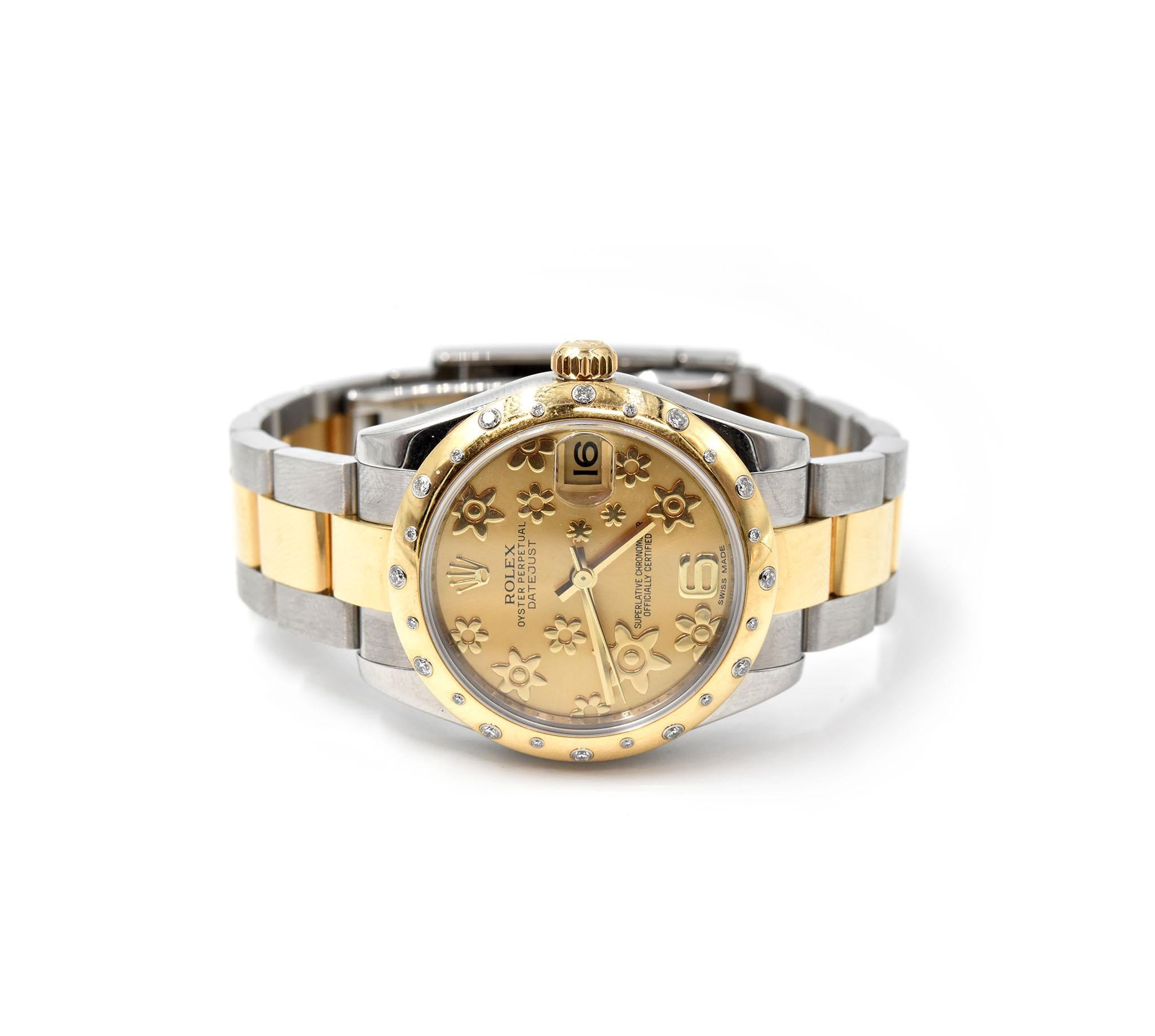 Movement: automatic
Function: hours, minutes, seconds, date
Case: 31mm stainless steel case with 18k yellow gold diamond bezel set with 24 sprinkled diamonds, inner reflector ring engraved with serial number 
Band: stainless steel and 18k yellow