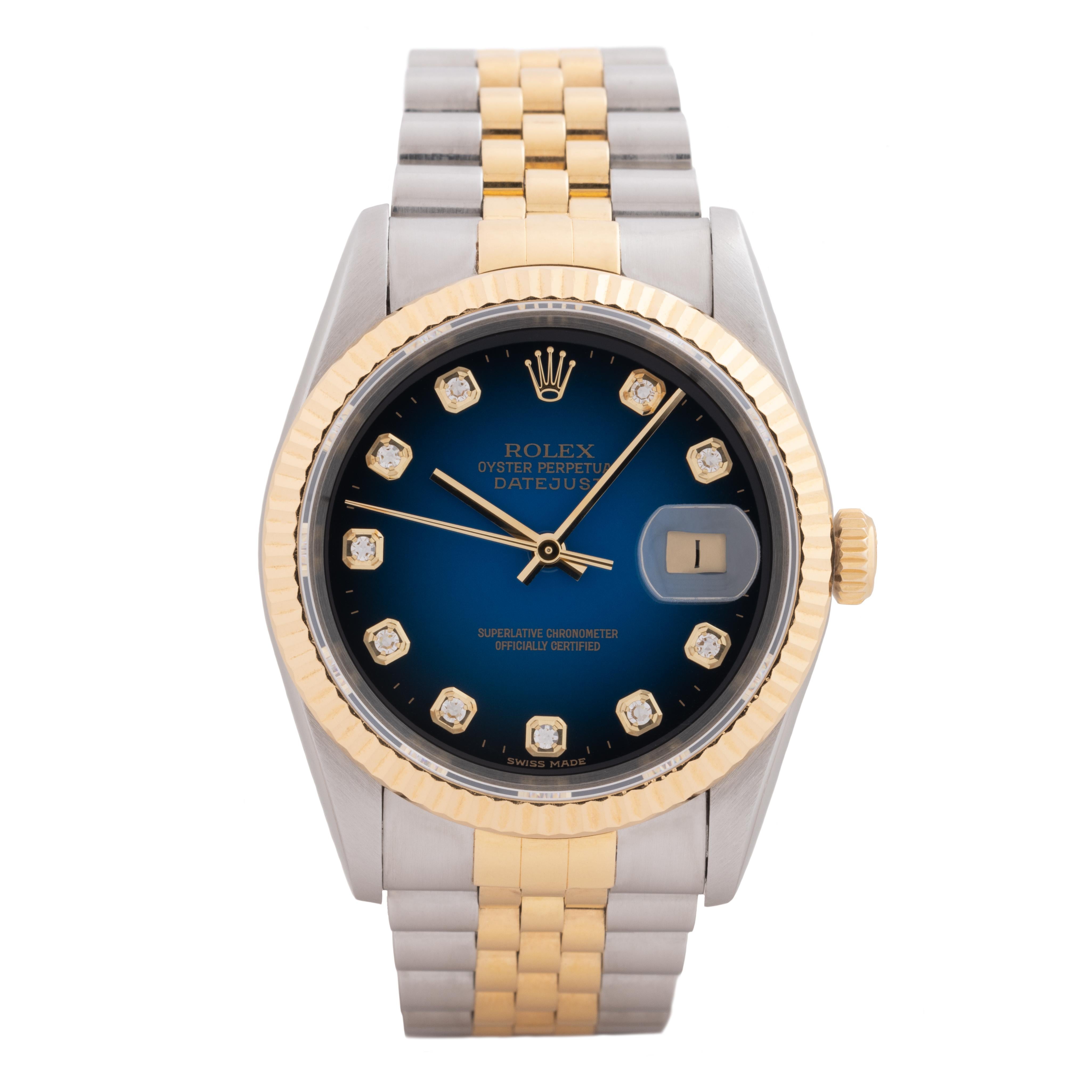 Rolex DateJust Model 16233 Stainless Steel and 18K Yellow Gold Blue Vignette and Diamond Markers, Automatic Movement, Jubilee Bracelet 
c.1996 
Made in Switzerland w/ Box and Papers
all original

Stephanie Windsor guarantees the proper functioning