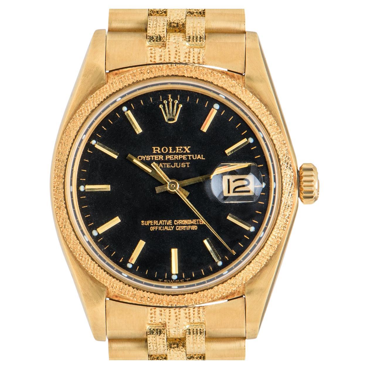 A 36mm NOS Datejust in yellow gold by Rolex. Featuring a matt black dial with applied hour markers and a fixed yellow gold bezel with a florentine finish. Equipped with an 18k yellow gold jubilee bracelet which features a florentine finish in the