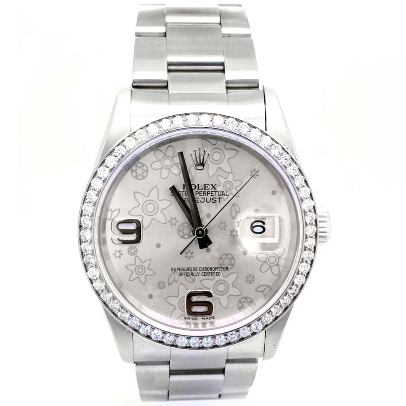 Stainless steel case with a stainless steel Oyster bracelet. Diamond bezel and floral motif dial with silver-tone hands and Arab hour markers. Dial Type: Analog. Date display at the 3 o'clock position. Automatic movement. Scratch-resistant sapphire