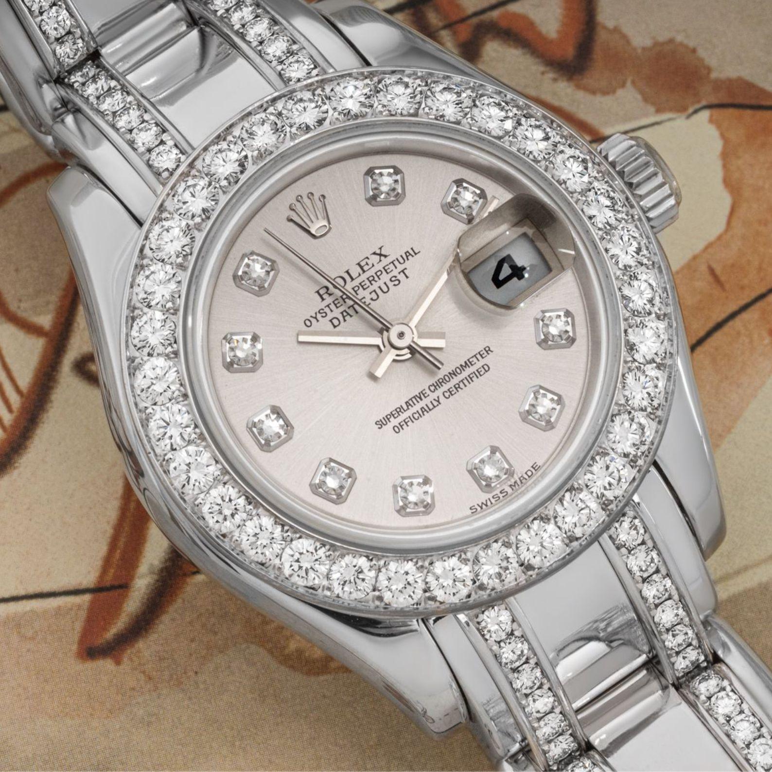 A white Gold Datejust Pearlmaster by Rolex. Features a silver dial with diamond hour markers and a fixed white gold bezel set with approximately 32 round brilliant cut diamonds.

The white gold Pearlmaster bracelet is set with 154 round brilliant